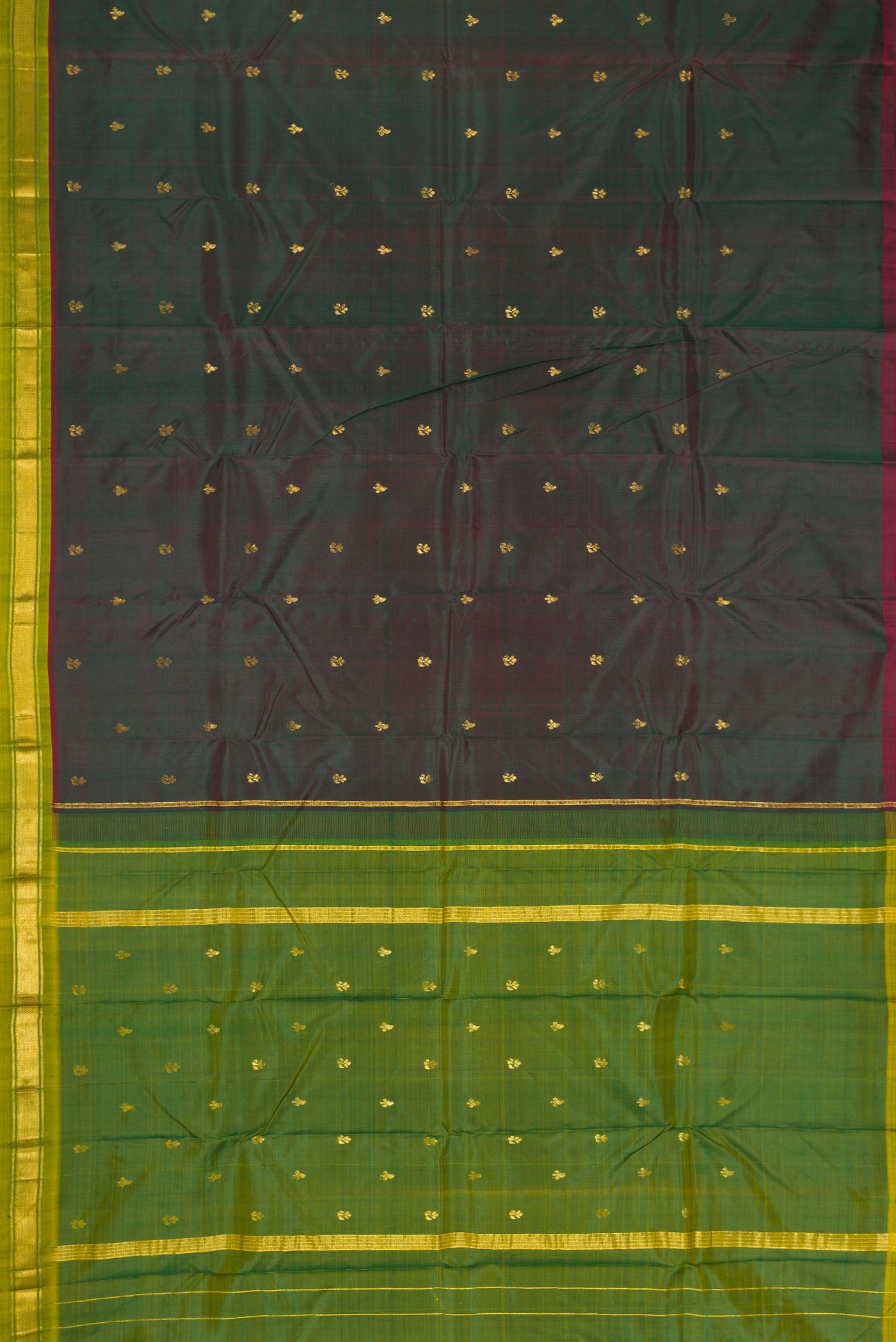 Bottle Green Dual Tone Kanchipuram Silk Saree with Zari Butta on the body and Zari Border.  displayed on a mannequin