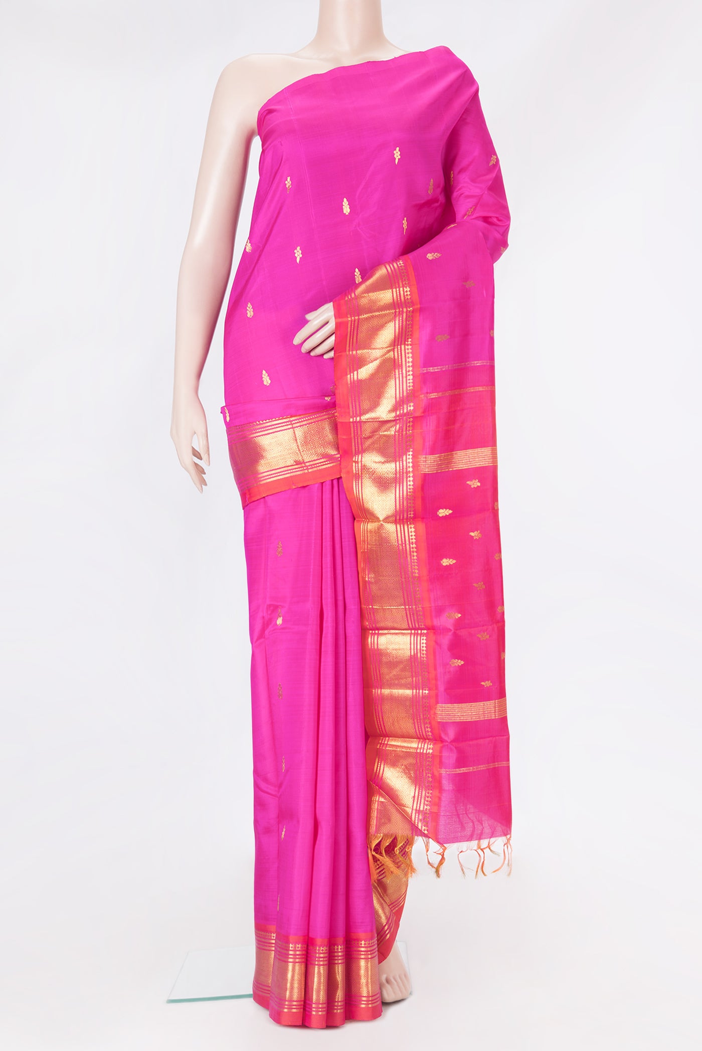 Pink Kanjivaram Silk Saree with Zari Butta on the body and One Side Border.  displayed on a mannequin