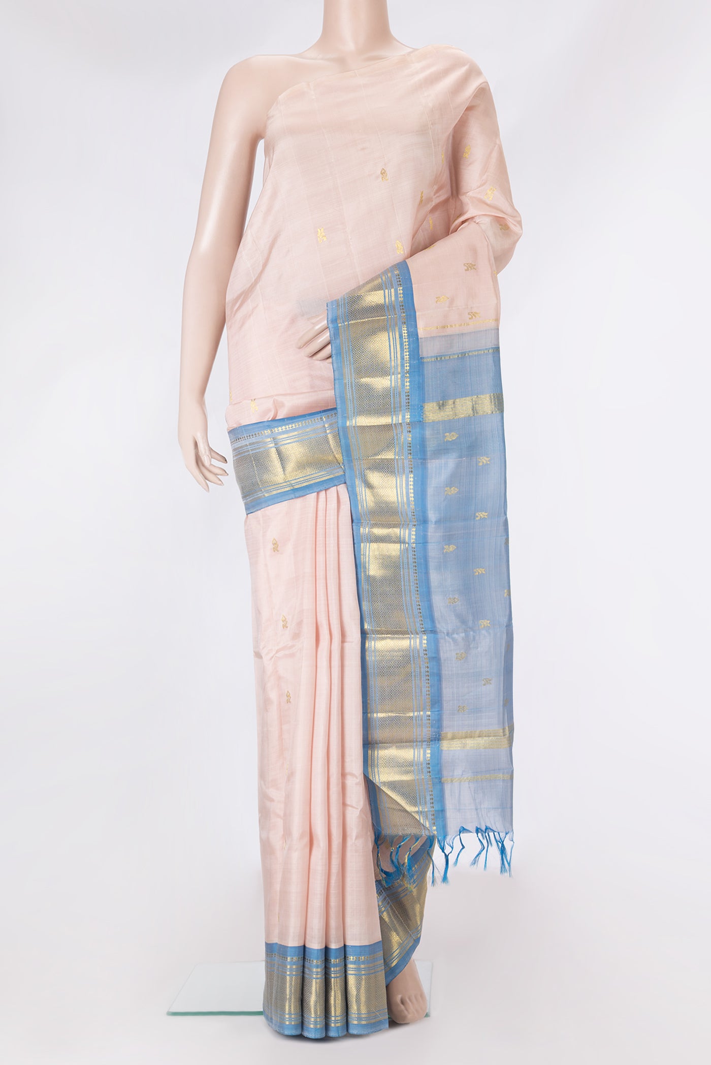 Rose Gold Kanjivaram Silk Saree with Zari Butta on the body and One Side Border.  displayed on a mannequin