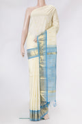 Off White Kanjivaram Silk Saree with Zari Butta on the body and One Side Border.  displayed on a mannequin
