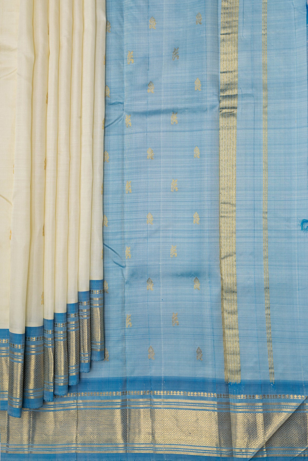 Pleats and pallu of Off White Kanjivaram Silk Saree with Zari Butta on the body and One Side Border. 