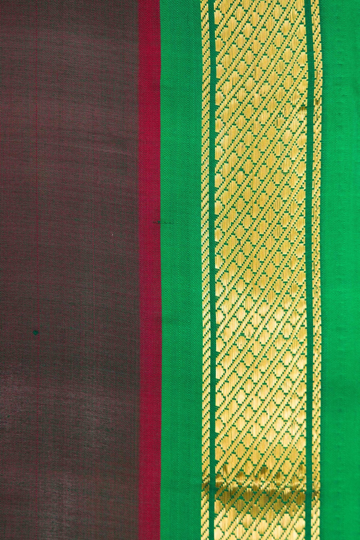 Border image of Bottle Green Dual Tone Kanchipuram Silk Saree with Plain Body and Zari Border. 