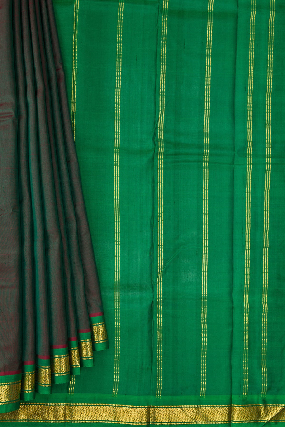 Pleats and pallu of Bottle Green Dual Tone Kanchipuram Silk Saree with Plain Body and Zari Border. 