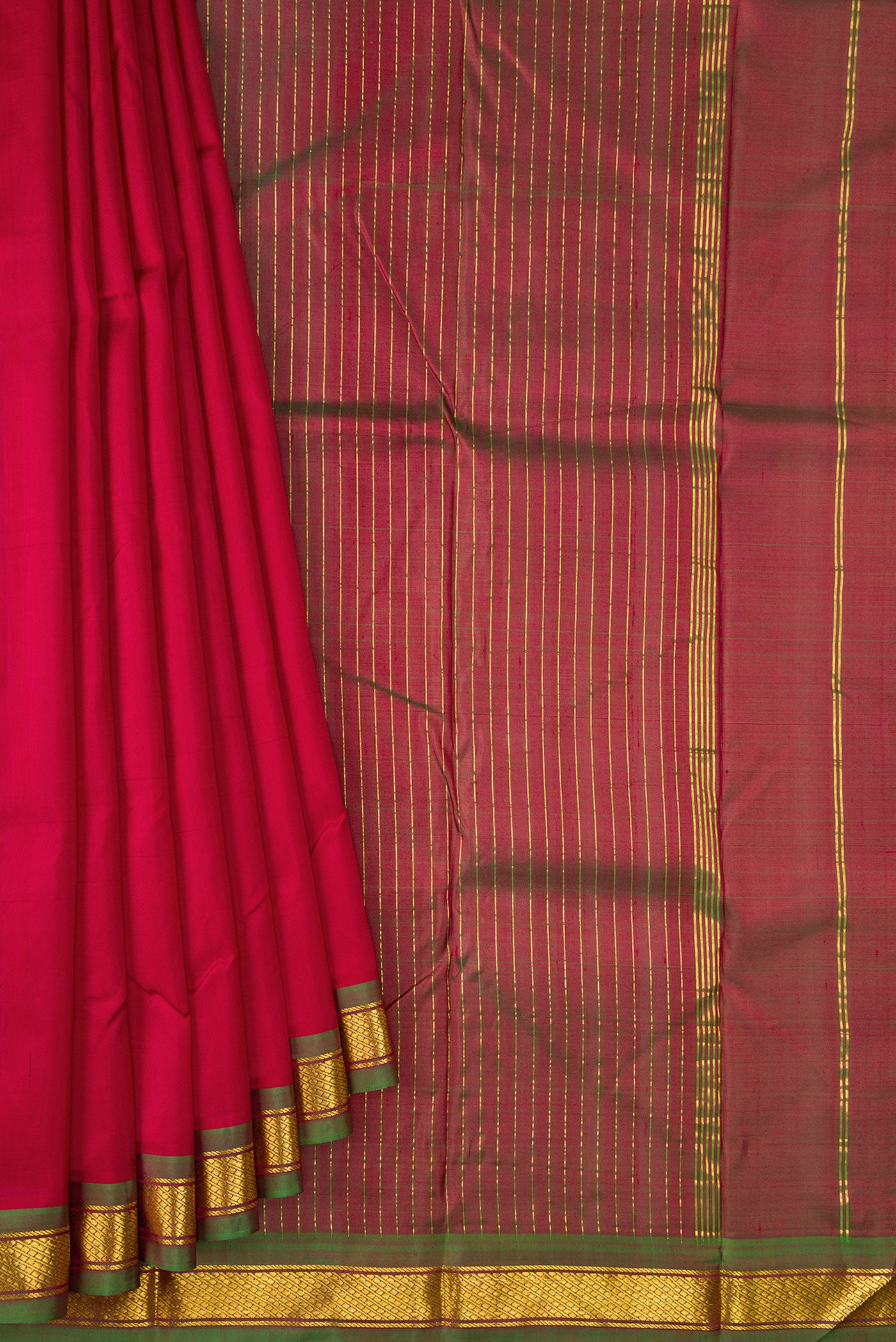 Pleats and pallu of Maroon Dual Tone Kanchipuram Silk Saree with Plain Body and Zari Border. 