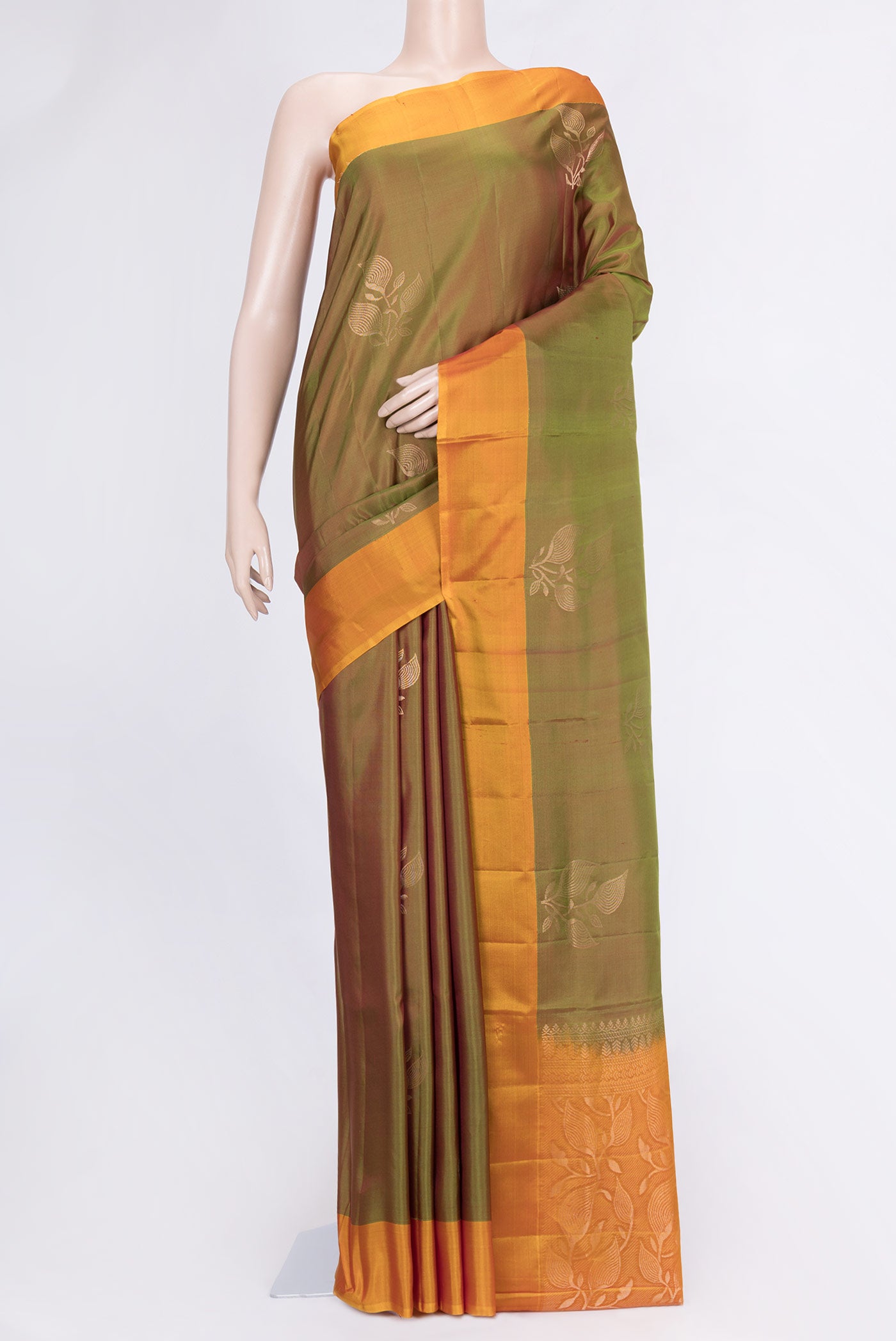 Green Dual Tone Soft Silk Saree with Zari Butta on the body and Zari Border.  displayed on a mannequin