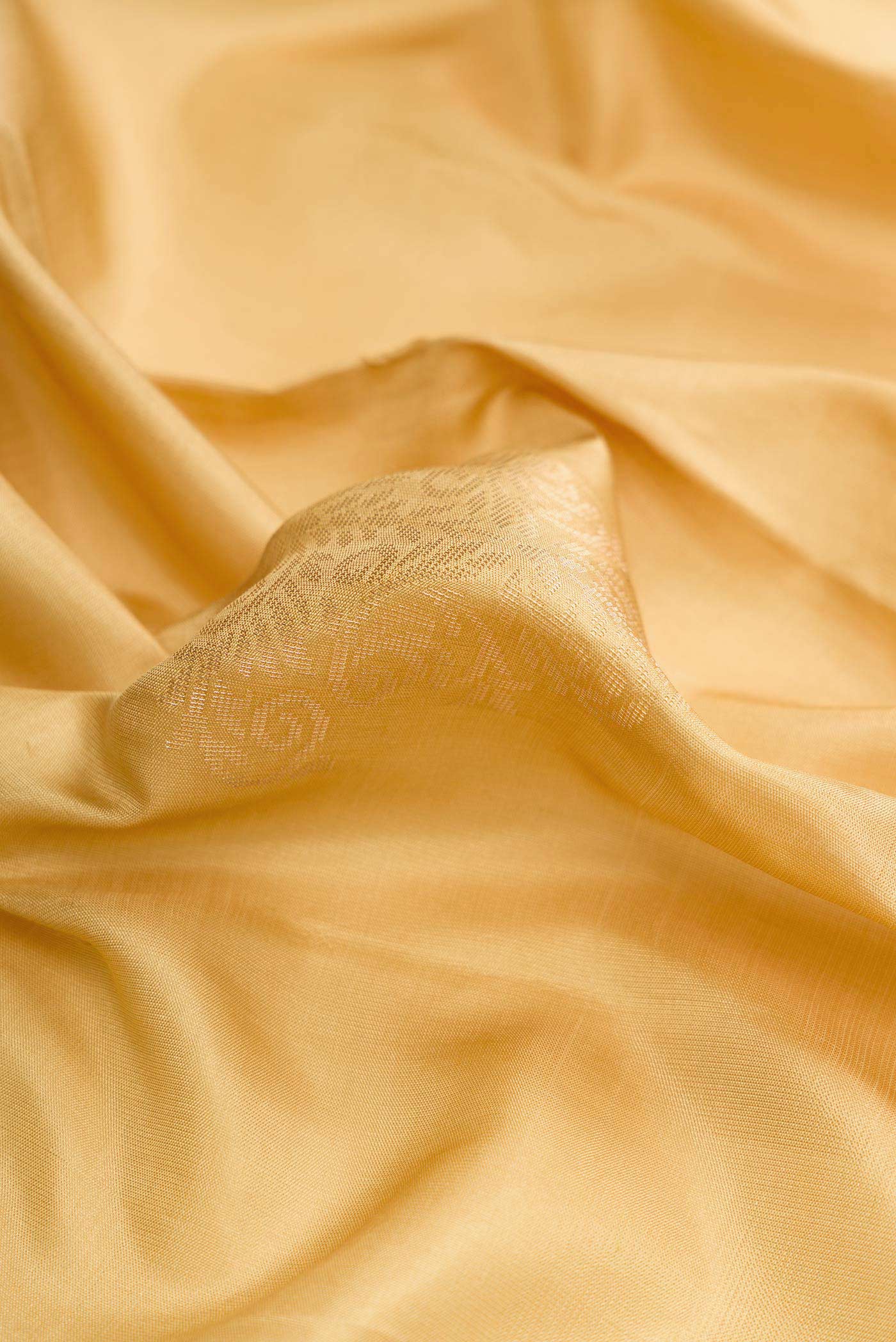 Close up of Sandal Dual Tone Soft Silk Saree with Zari Butta on the body and Zari Border.  displaying folds