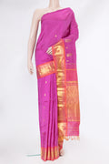 Magenta Kanjivaram Silk Saree with Zari Butta on the body and One Side Border.  displayed on a mannequin