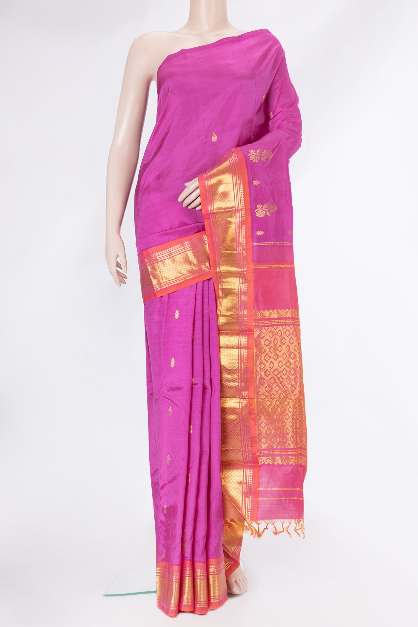 Magenta Kanjivaram Silk Saree with Zari Butta on the body and One Side Border.  displayed on a mannequin