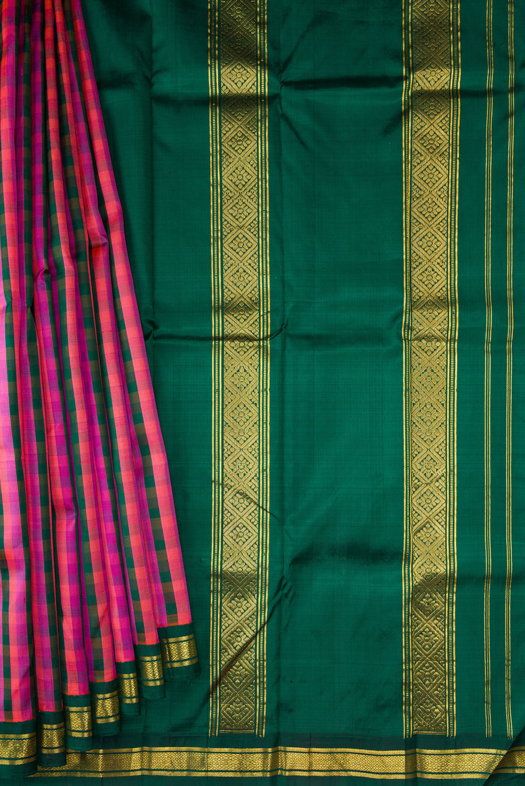 Pleats and pallu of Bottle Green, Pink and Purple Color Kanjivaram Silk Saree with Checked design on the body and Zari Border. 