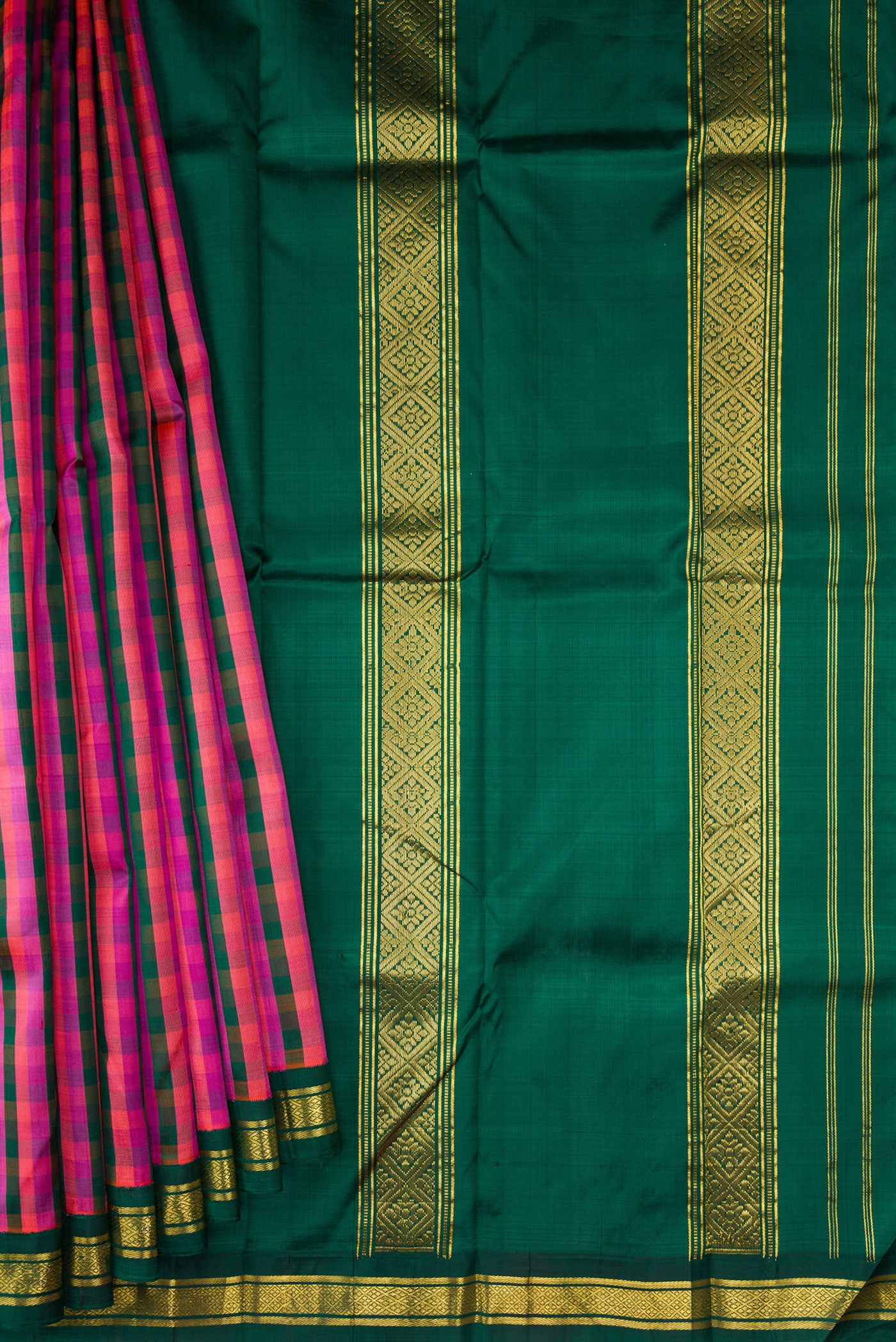 Pleats and pallu of Bottle Green, Pink and Purple Color Kanjivaram Silk Saree with Checked design on the body and Zari Border. 