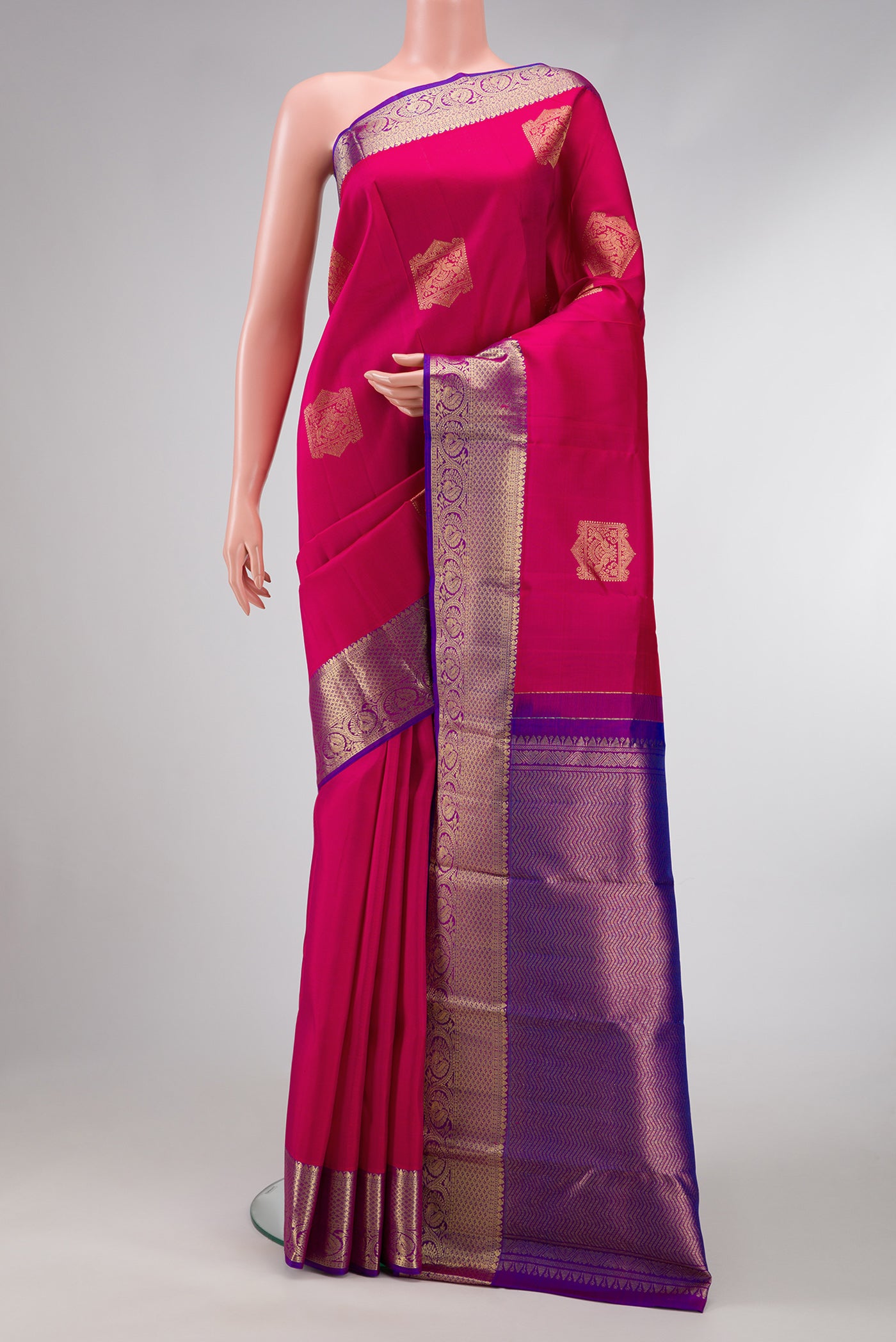 Pink Dual Tone Kanjivaram Silk Saree with Zari Butta on the body and Zari Border.  displayed on a mannequin