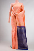 Peach Dual Tone Kanjivaram Silk Saree with Zari Butta on the body and Without Border.  displayed on a mannequin
