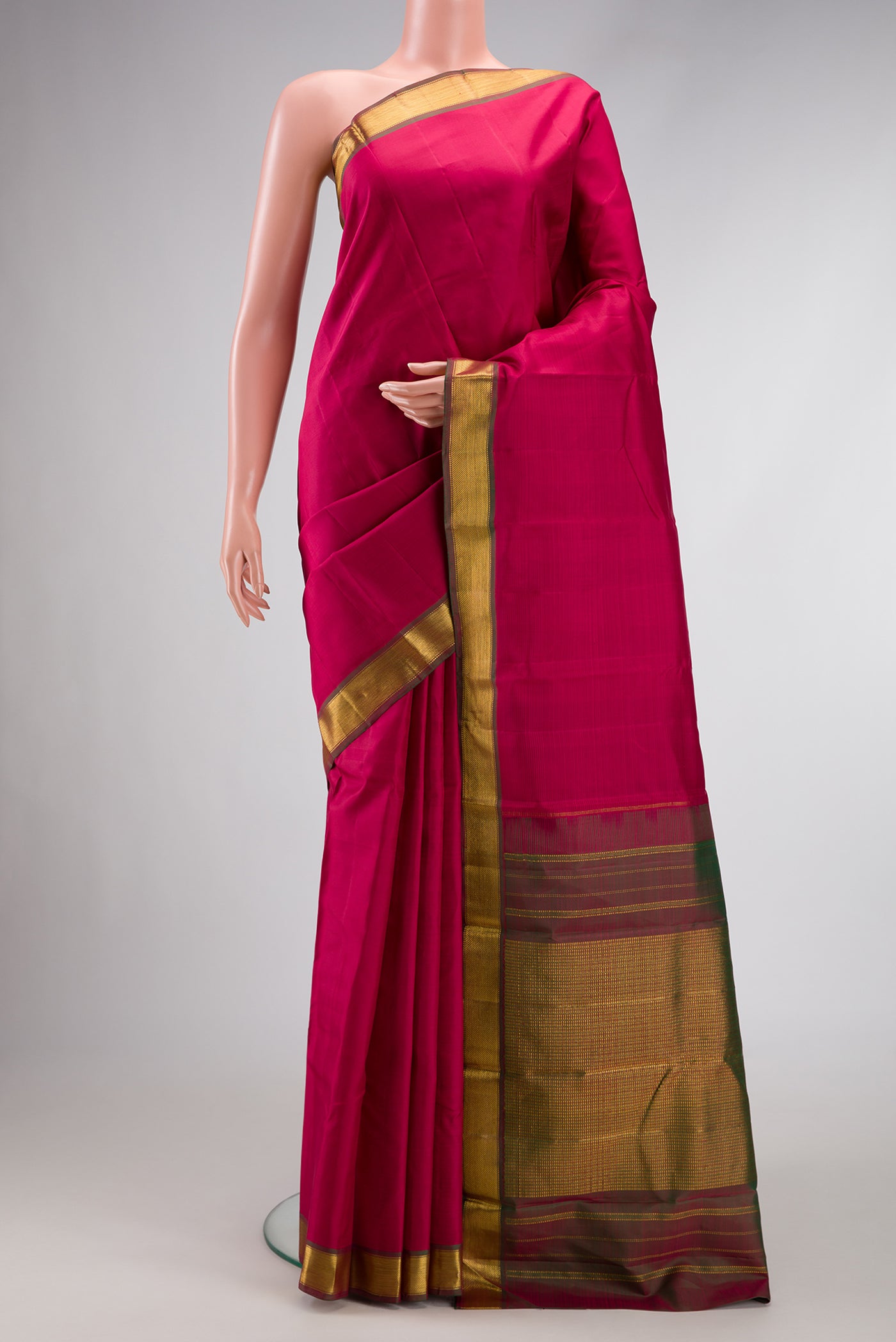Maroon Dual Tone Kanjivaram Silk Saree with Plain Body and Zari Border.  displayed on a mannequin