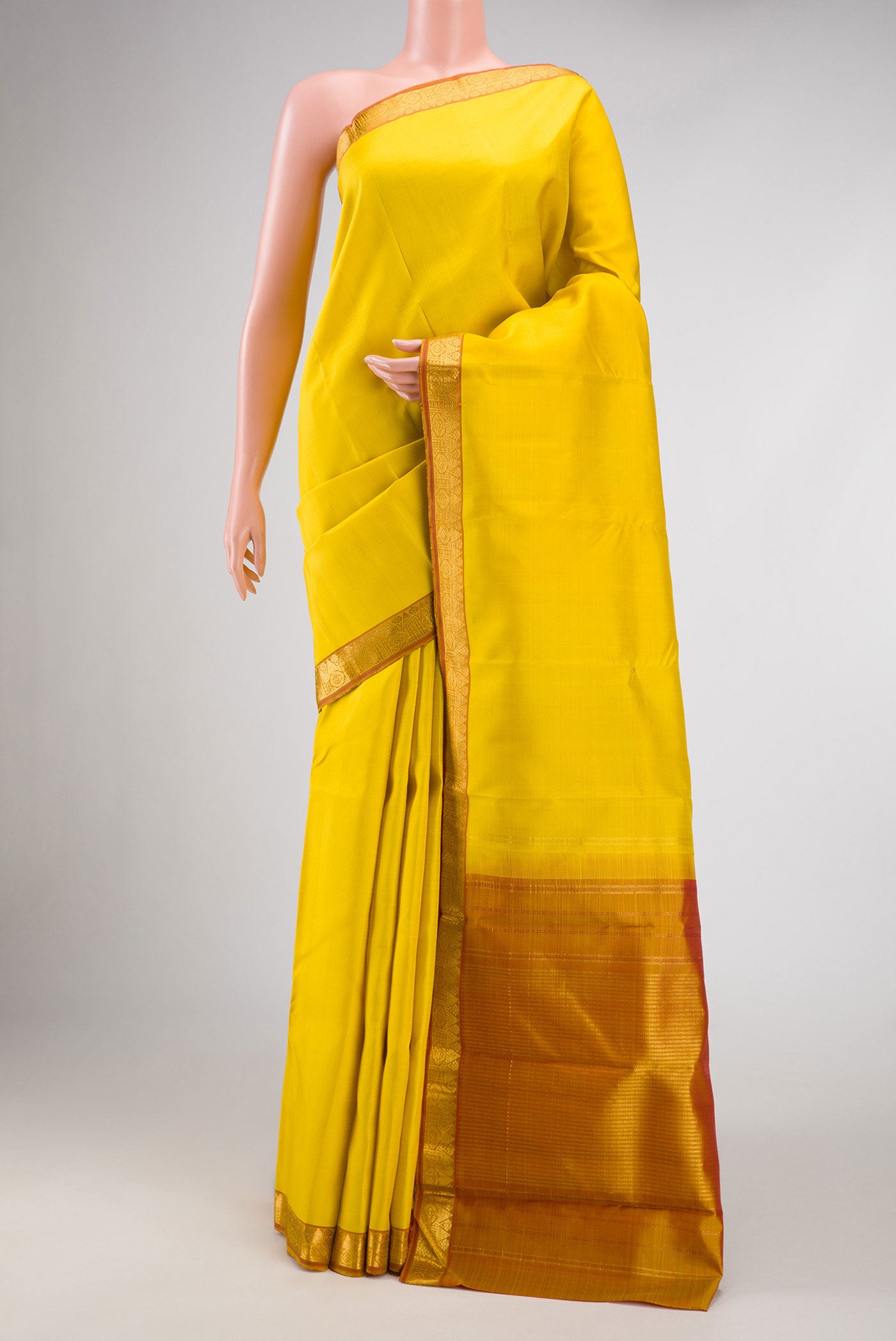 Lemon Yellow Dual Tone Kanjivaram Silk Saree with Plain Body and Zari Border.  displayed on a mannequin
