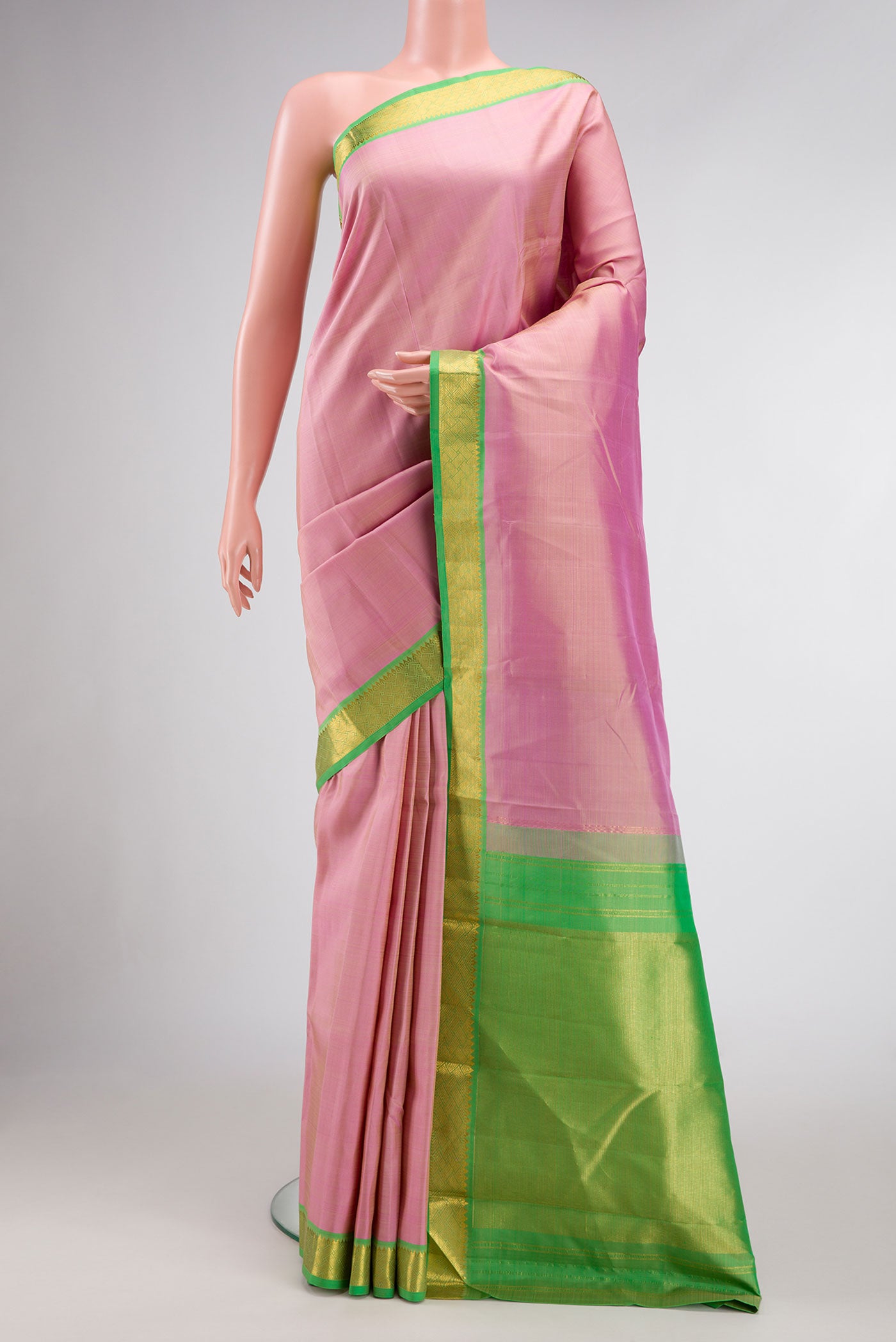 Pink Dual Tone Kanjivaram Silk Saree with Plain Body and Zari Border.  displayed on a mannequin