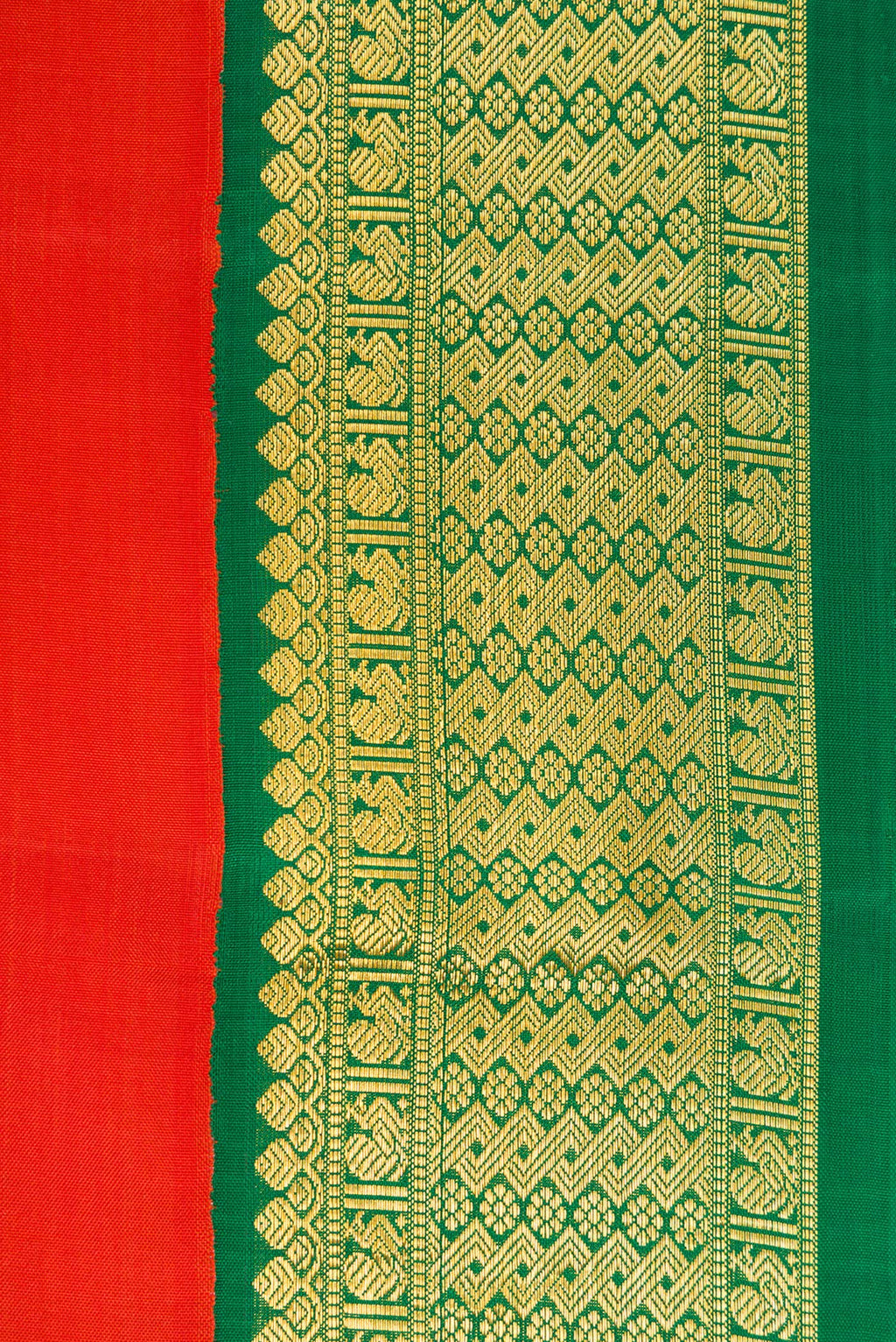 Border image of Brick Orange Dual Tone Kanjivaram Silk Saree with Plain Body and Zari Border. 
