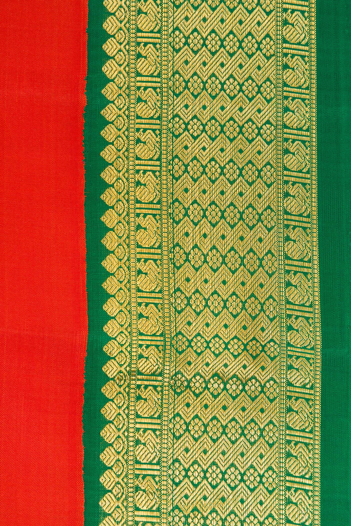 Border image of Brick Orange Dual Tone Kanjivaram Silk Saree with Plain Body and Zari Border. 
