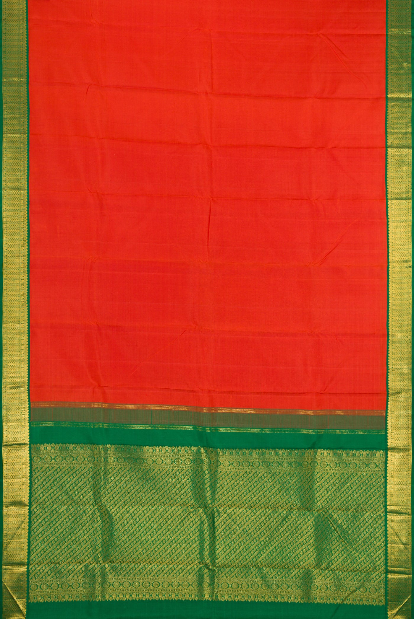 Flat view of Brick Orange Dual Tone Kanjivaram Silk Saree with Plain Body and Zari Border. 