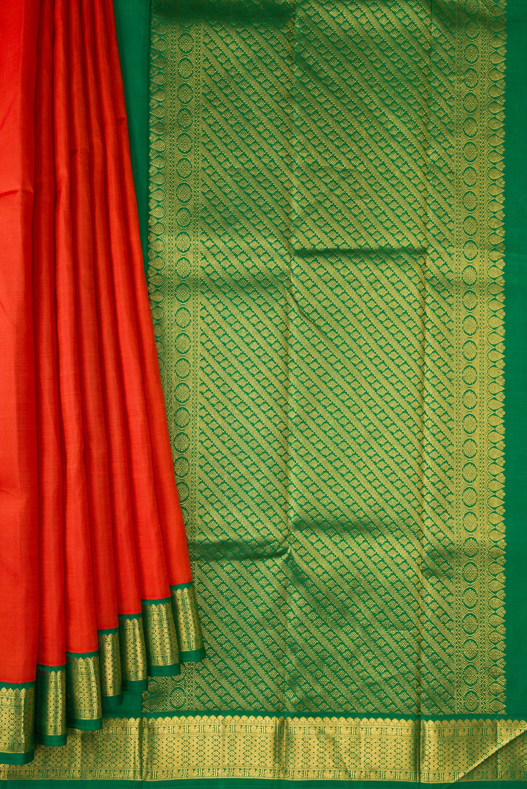Pleats and pallu of Brick Orange Dual Tone Kanjivaram Silk Saree with Plain Body and Zari Border. 