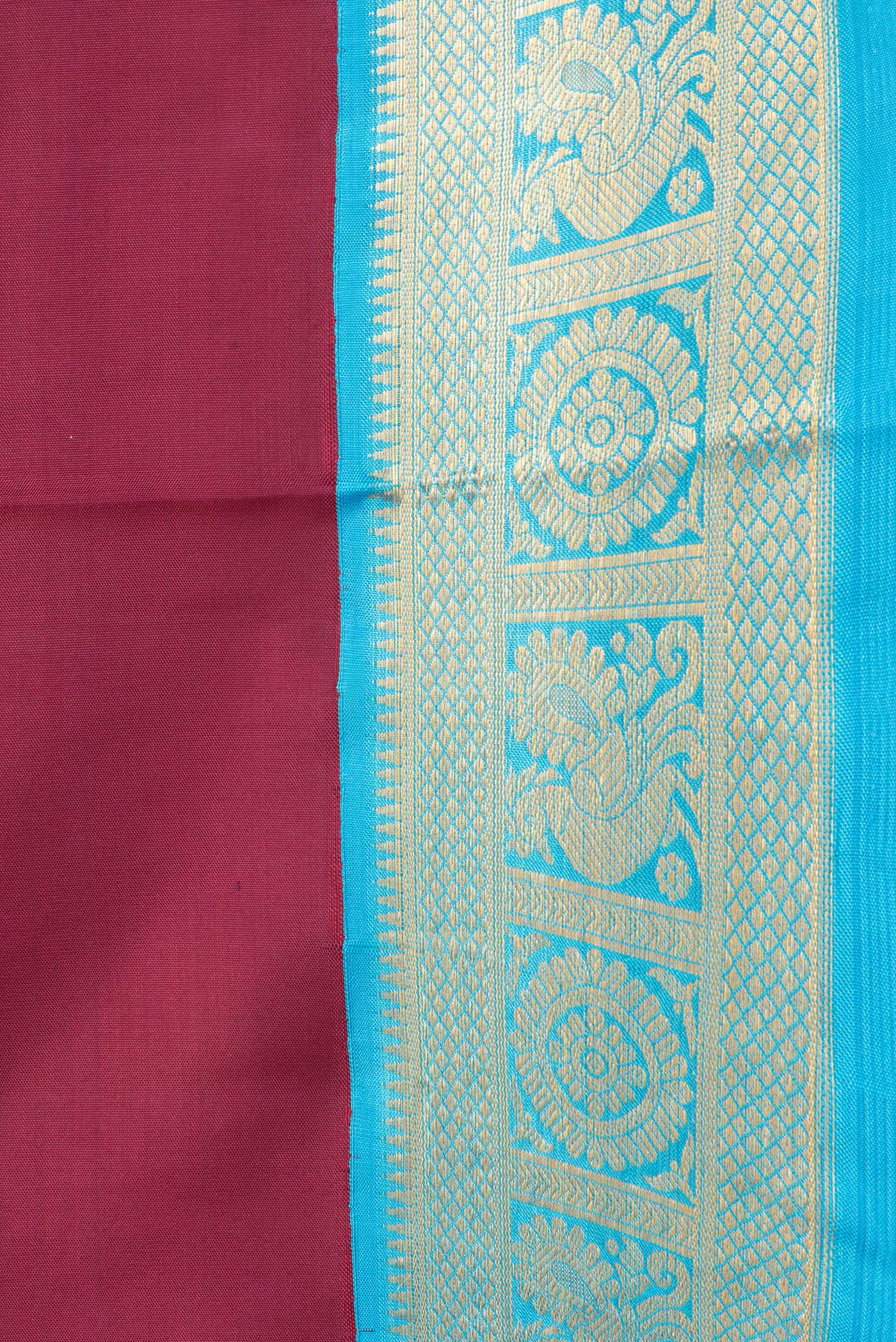Border image of Maroon Dual Tone Kanjivaram Silk Saree with Plain Body and Zari Border. 