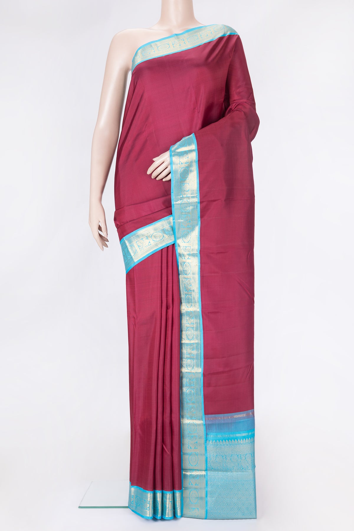 Maroon Dual Tone Kanjivaram Silk Saree with Plain Body and Zari Border.  displayed on a mannequin