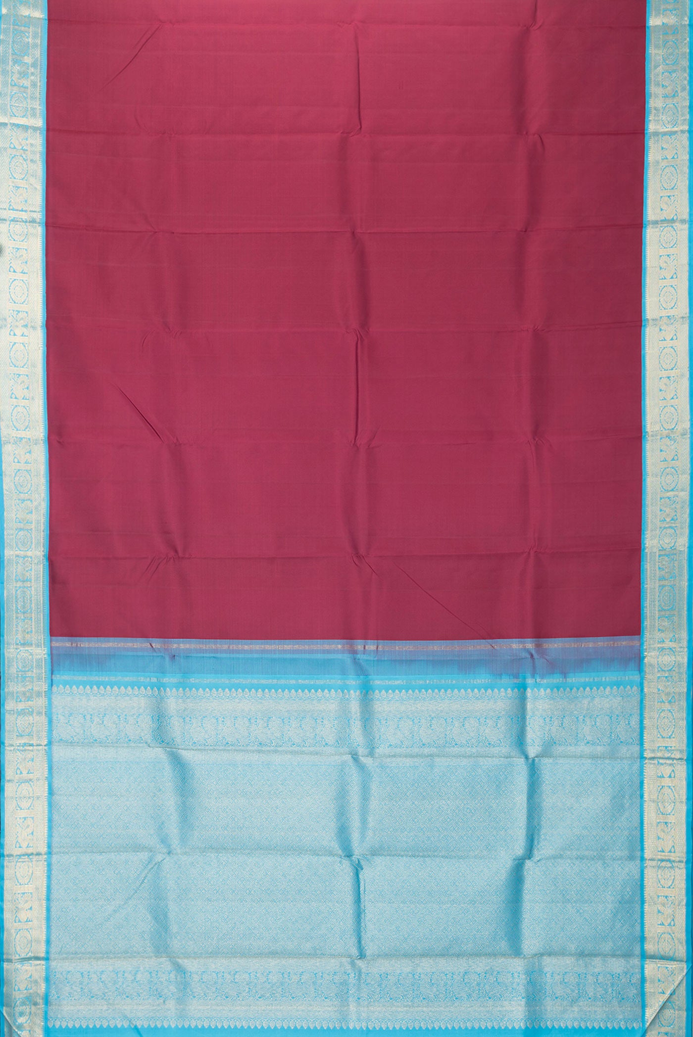 Flat view of Maroon Dual Tone Kanjivaram Silk Saree with Plain Body and Zari Border. 
