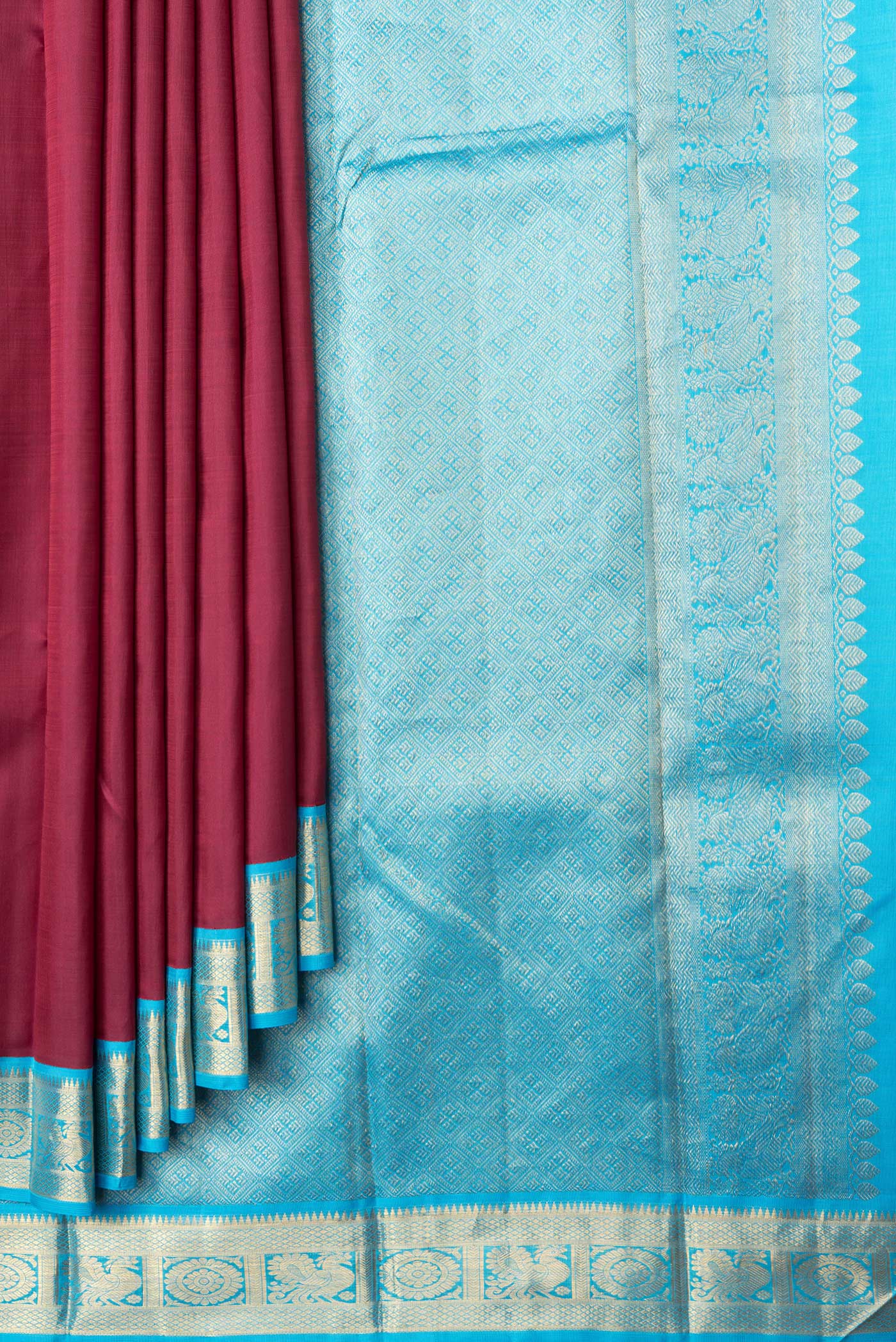 Pleats and pallu of Maroon Dual Tone Kanjivaram Silk Saree with Plain Body and Zari Border. 