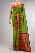 Pure Silk Mehandi Green Bangalore Saree with Plain Body and Temple Border.  displayed on a mannequin
