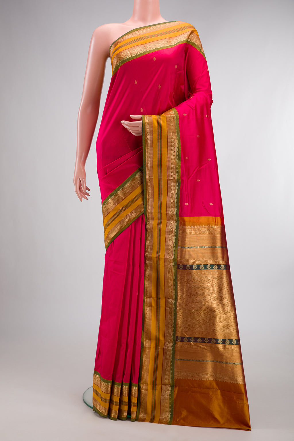 Pure Silk Dark Pink Bangalore Saree with Zari Butta on the body and Zari Border.  displayed on a mannequin