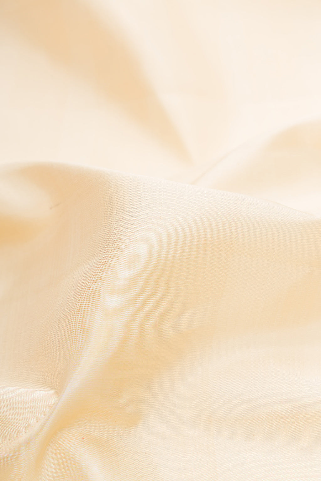 Close up of Sandal Dual Tone Kanjivaram Silk Saree with Plain Body and Checks Border.  displaying folds