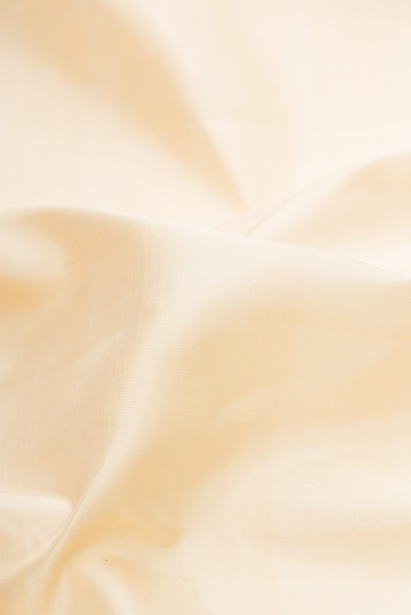 Close up of Sandal Dual Tone Kanjivaram Silk Saree with Plain Body and Checks Border.  displaying folds
