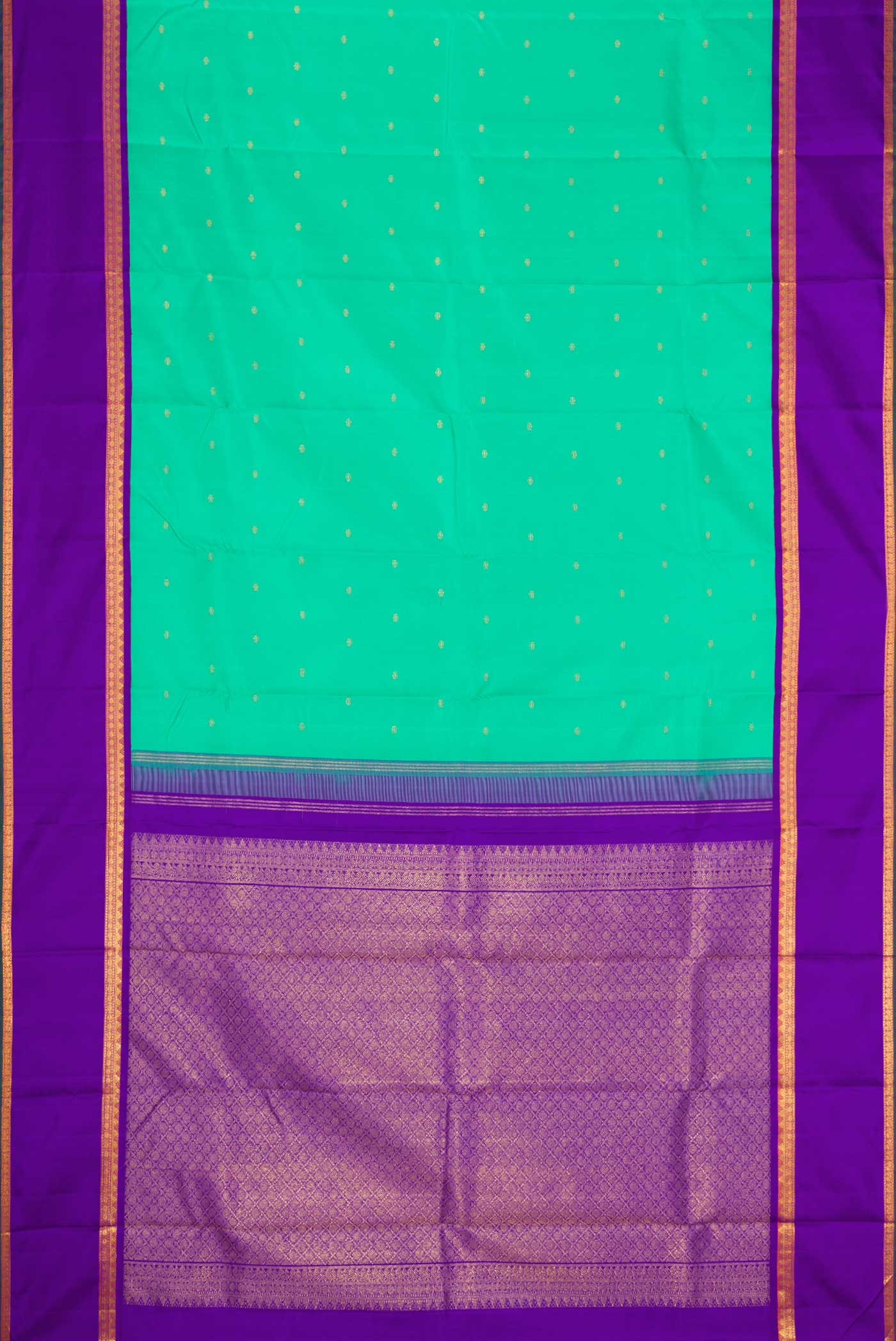 Flat view of Sea Green Dual Tone Kanjivaram Silk Saree with Zari Butta on the body and Zari Border. 