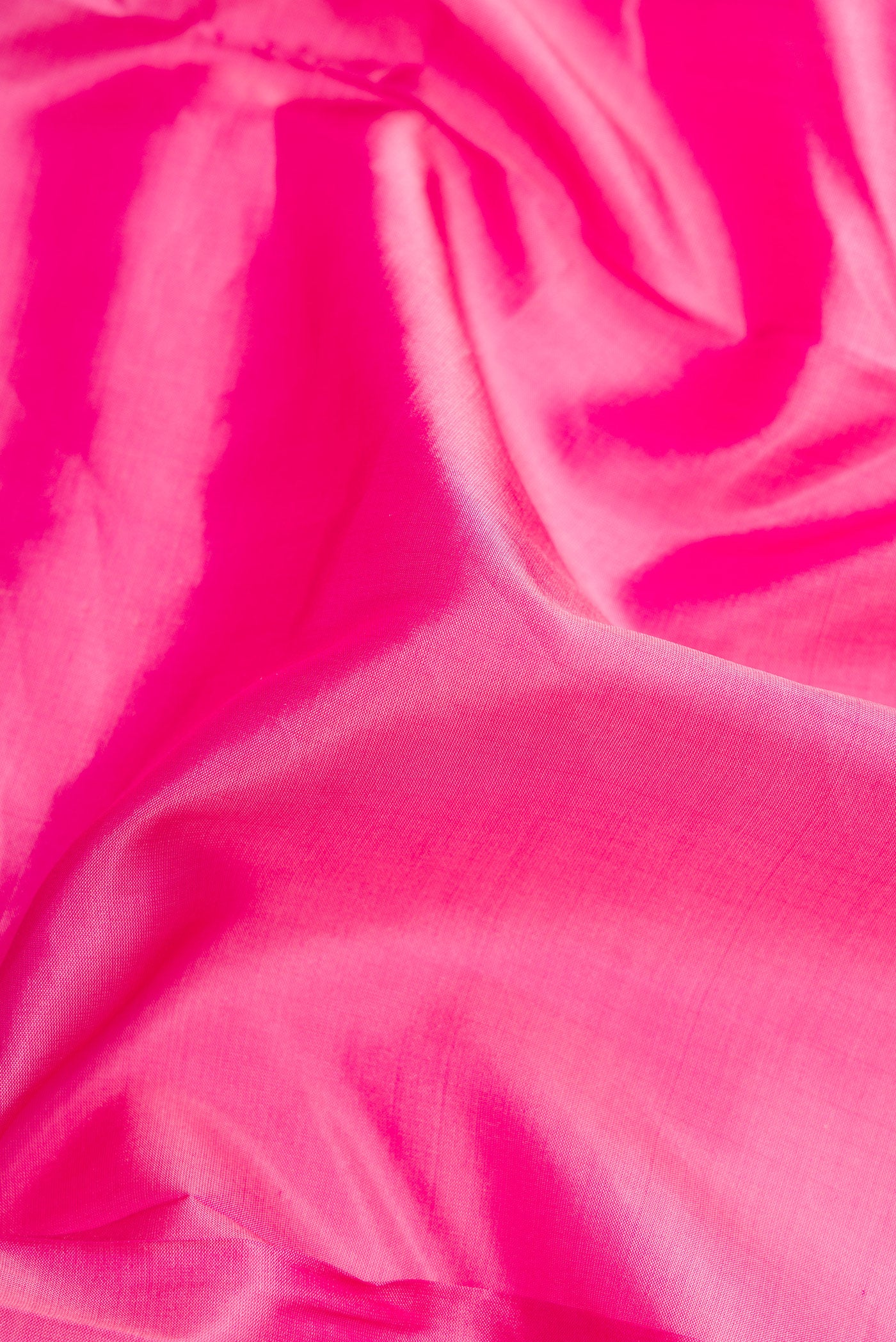 Close up of Pink Dual Tone Kanchipuram Silk Nine Yards Saree with Plain Body and Zari Border.  displaying folds
