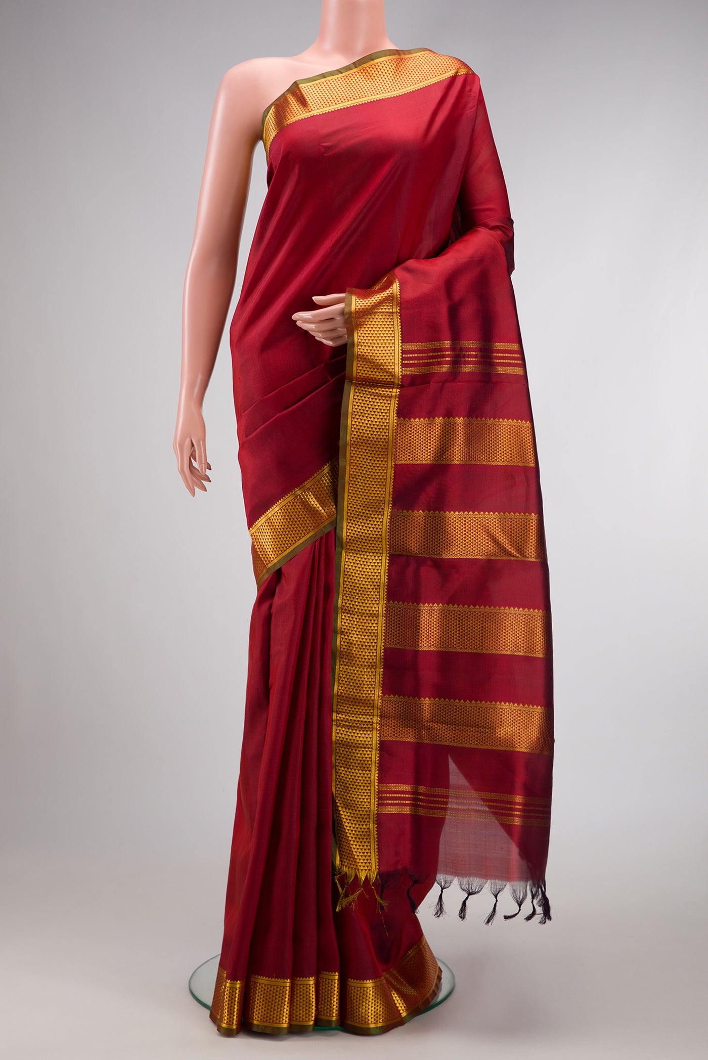 Maroon Dual Tone Kanchipuram Silk Nine Yards Saree with Plain Body and Zari Border.  displayed on a mannequin