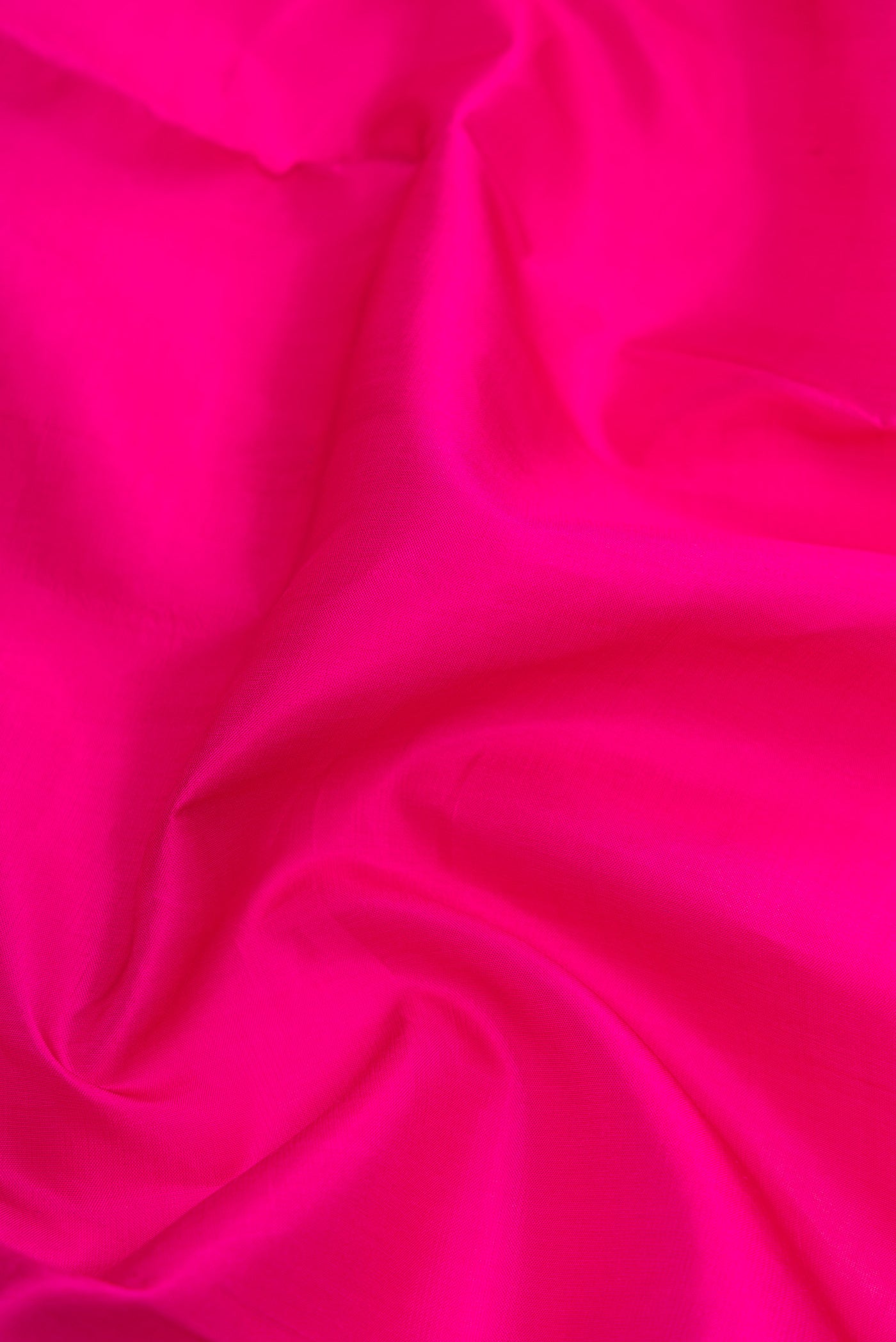 Close up of Pink Dual Tone Kanjivaram Silk Nine Yards Saree with Plain Body and Zari Border.  displaying folds