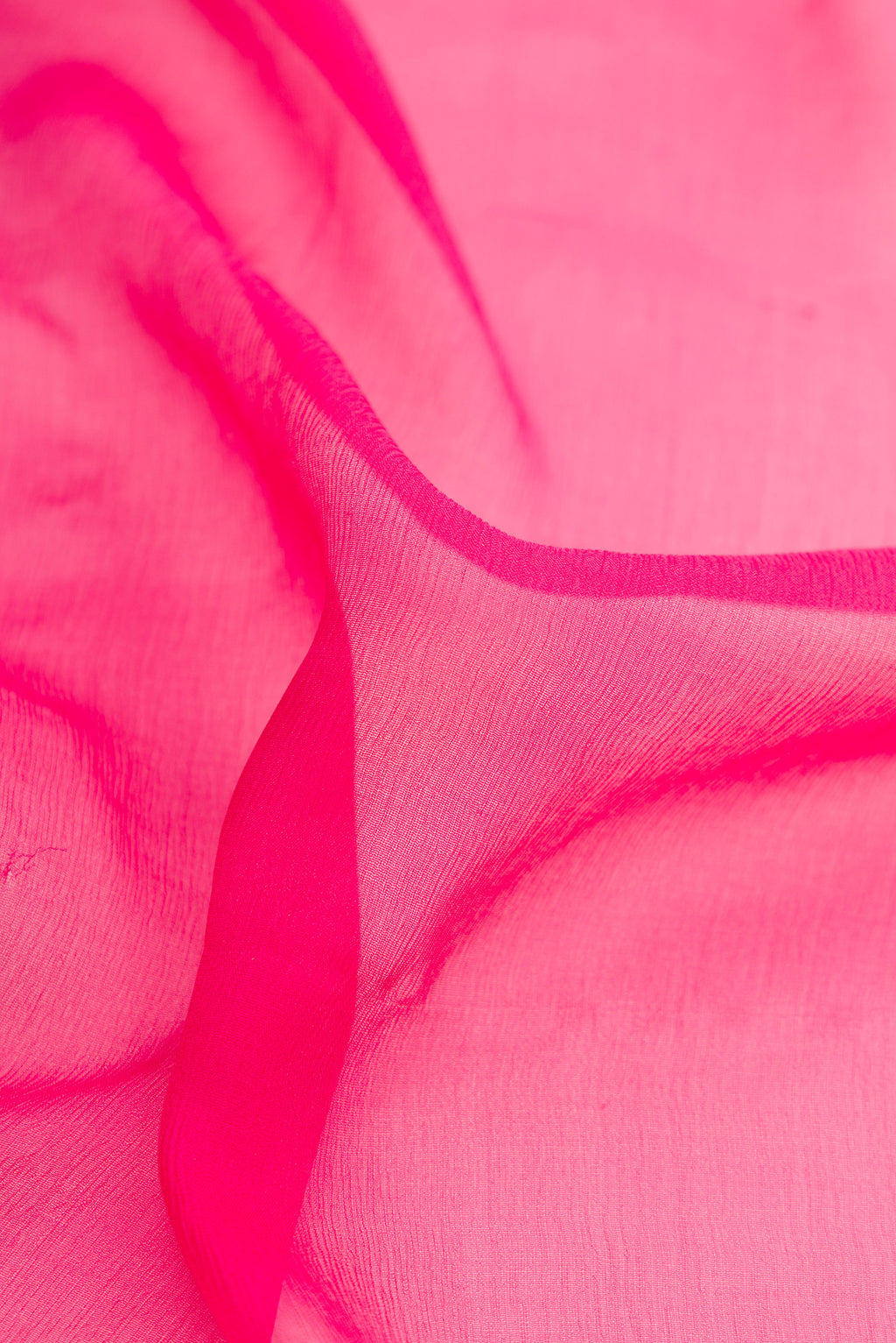 Close up of Pink Dual Tone Mysore Chiffon Saree with Plain Body and Zari Border.  displaying folds