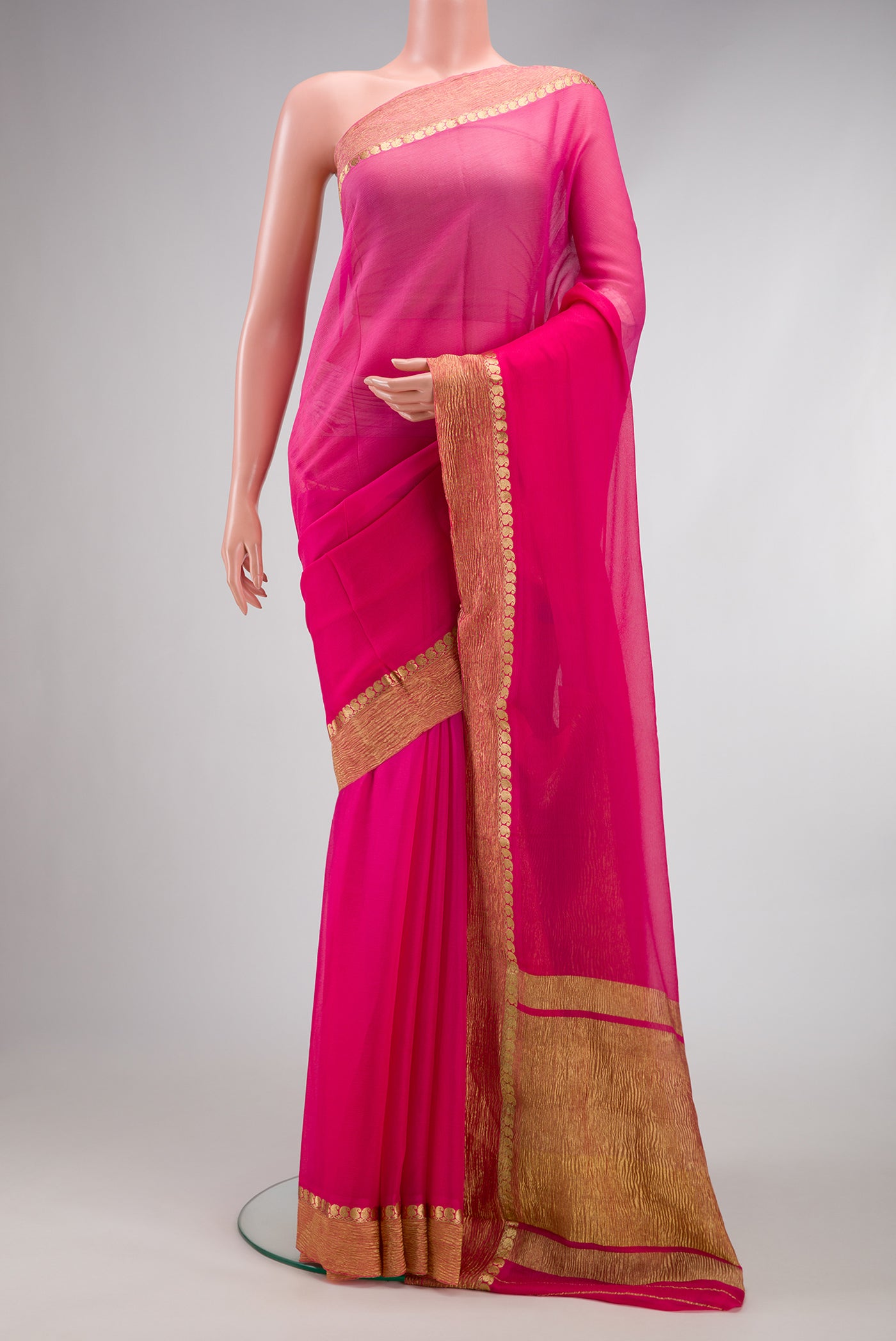 Pink Dual Tone Mysore Chiffon Saree with Plain Body and Zari Border.  displayed on a mannequin