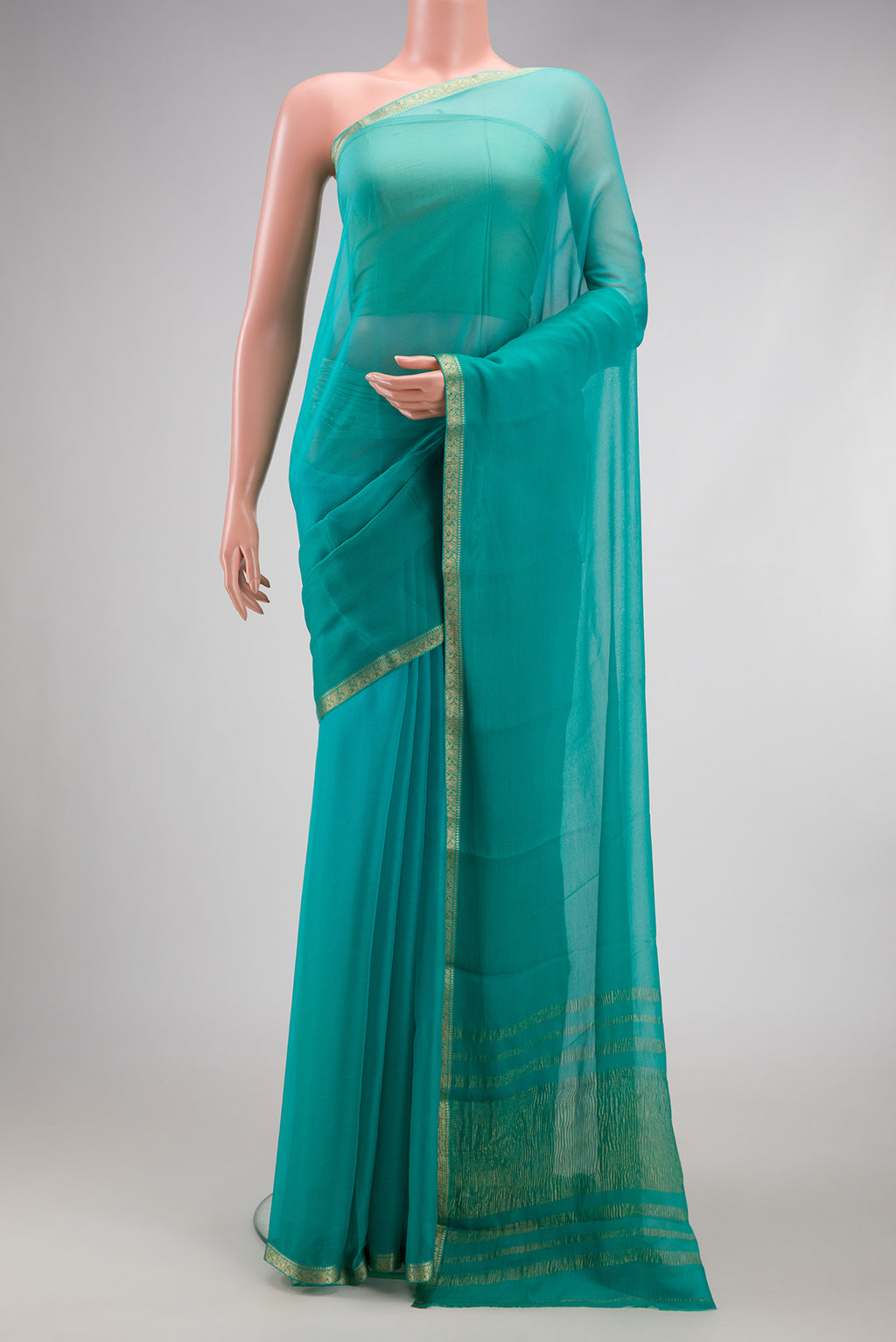 Sky Blue Mysore Chiffon Saree with Plain Body and Zari Border.  displayed on a mannequin