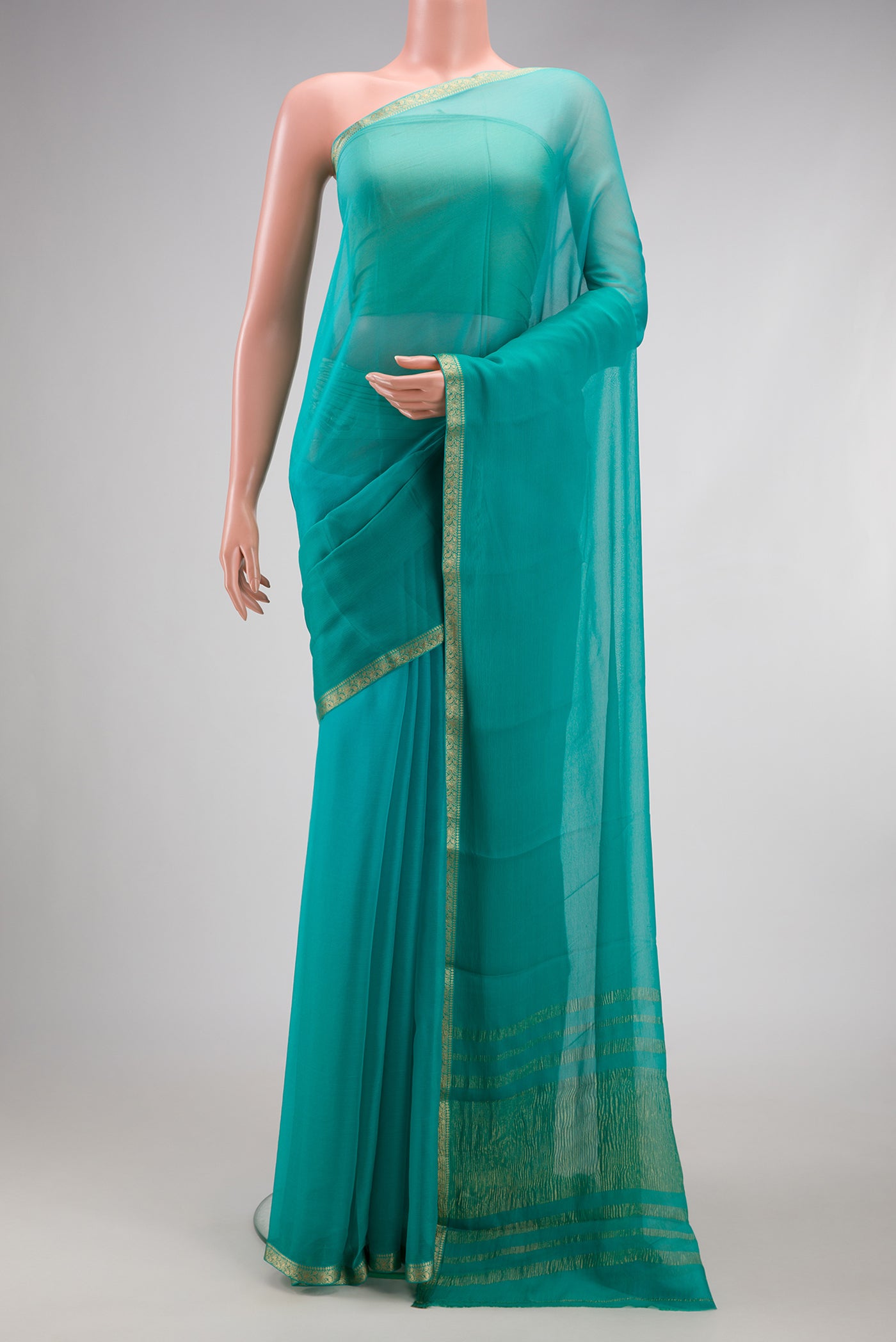 Sky Blue Mysore Chiffon Saree with Plain Body and Zari Border.  displayed on a mannequin