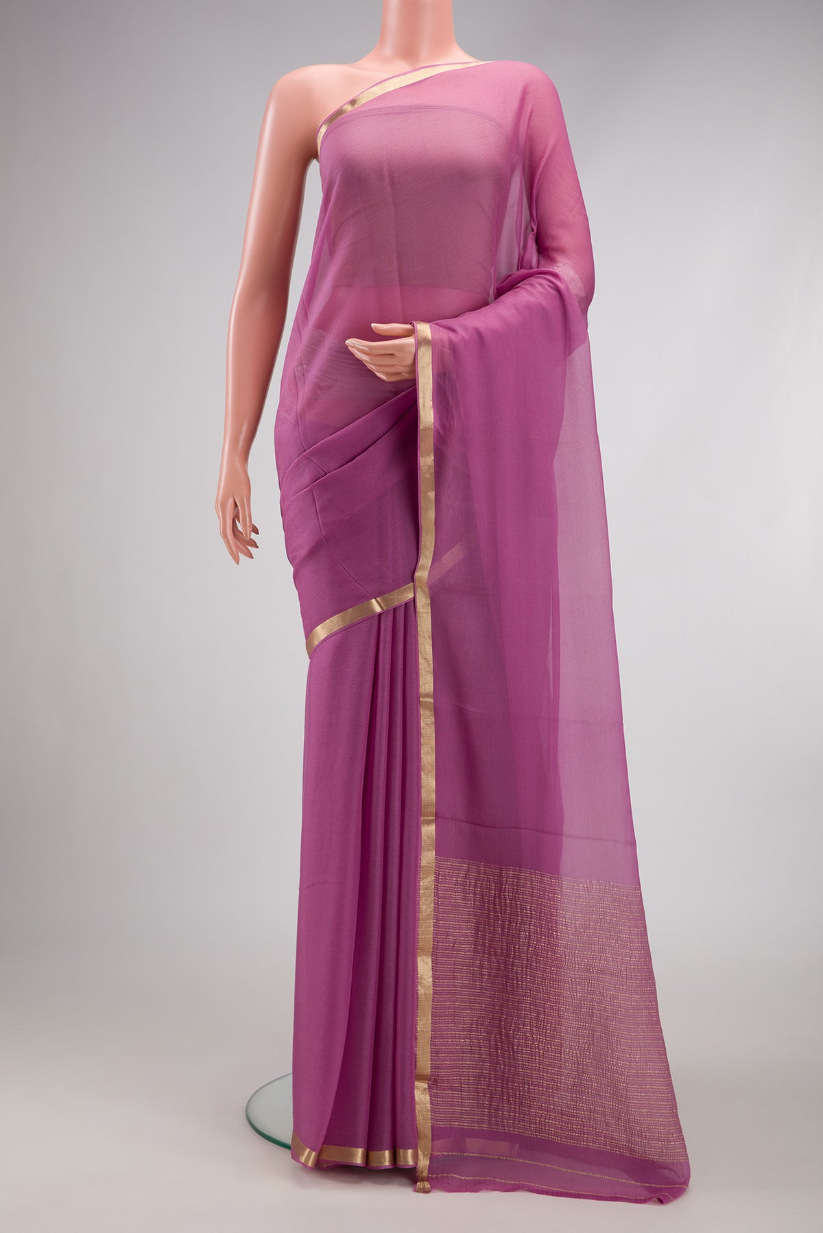 Lavender Mysore Chiffon Saree with Plain Body and Zari Border.  displayed on a mannequin
