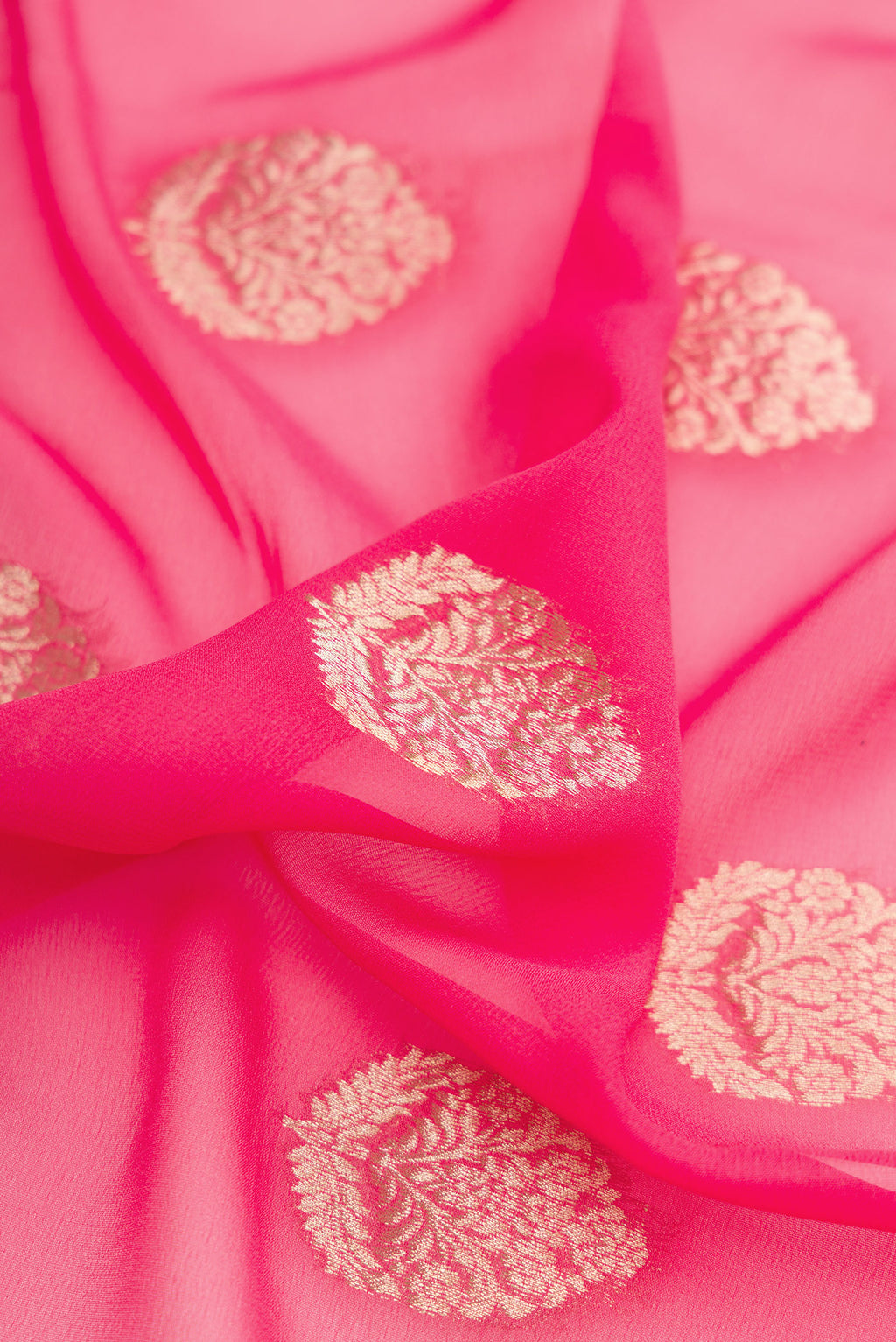 Close up of Pink Mysore Georgette Saree with Zari Butta on the body and Zari Border.  displaying folds