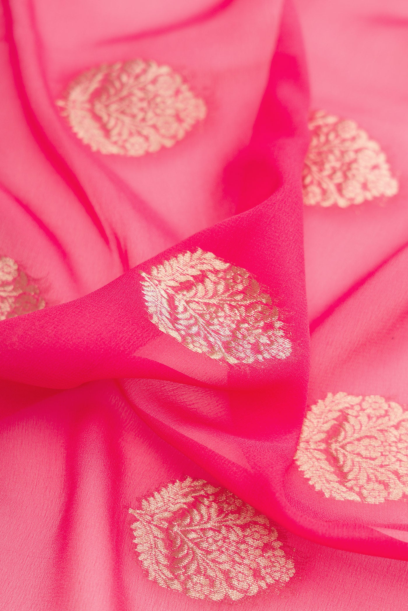 Close up of Pink Mysore Georgette Saree with Zari Butta on the body and Zari Border.  displaying folds