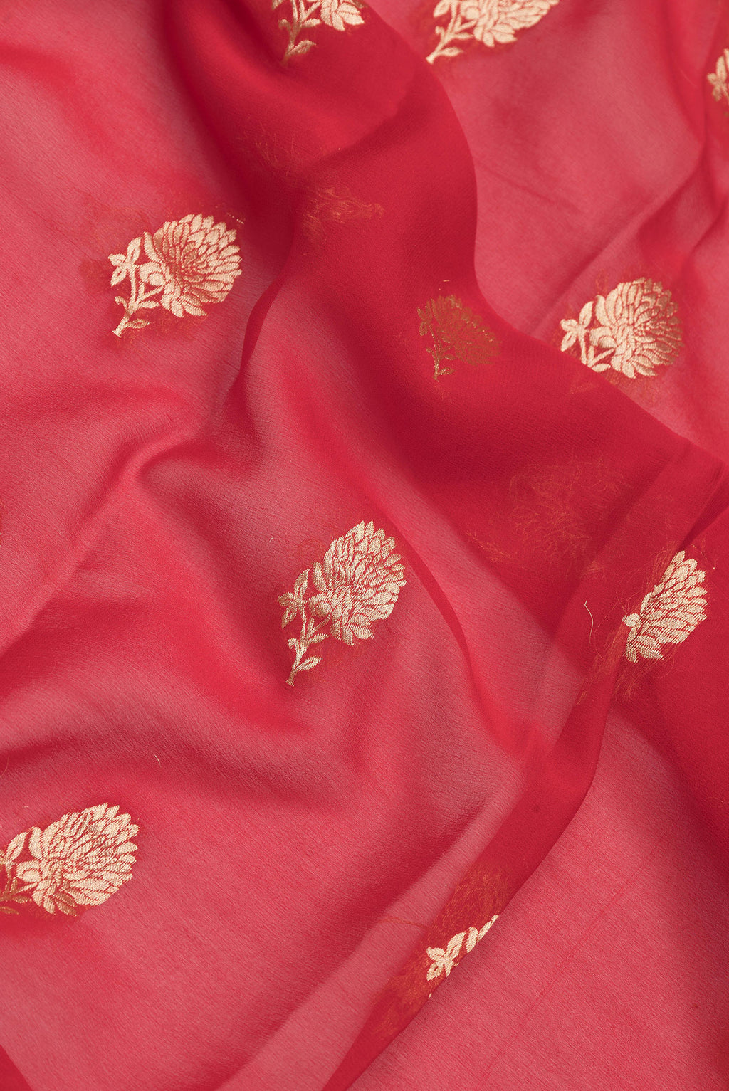 Close up of Red Dual Tone Mysore Georgette Saree with Zari Butta on the body and Zari Border.  displaying folds