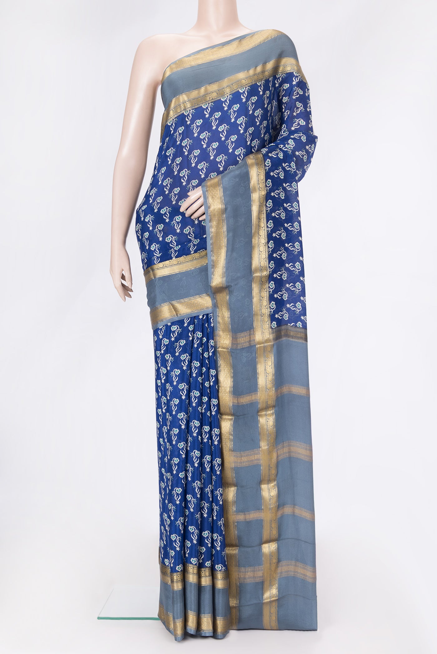 Navy Blue Dual Tone Mysore Crepe Saree with Printed design on the body and Zari Border.  displayed on a mannequin
