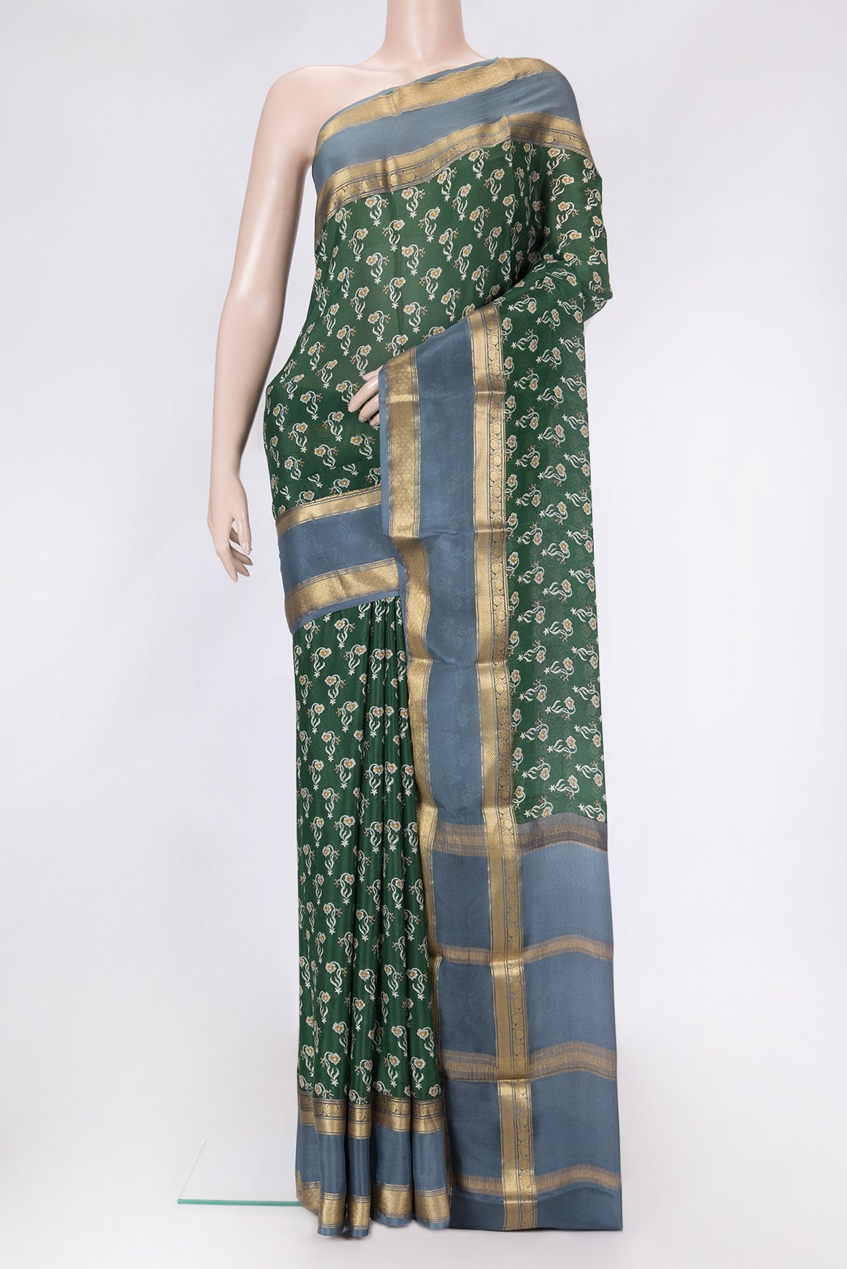 Green Dual Tone Mysore Crepe Saree with Printed design on the body and Zari Border.  displayed on a mannequin