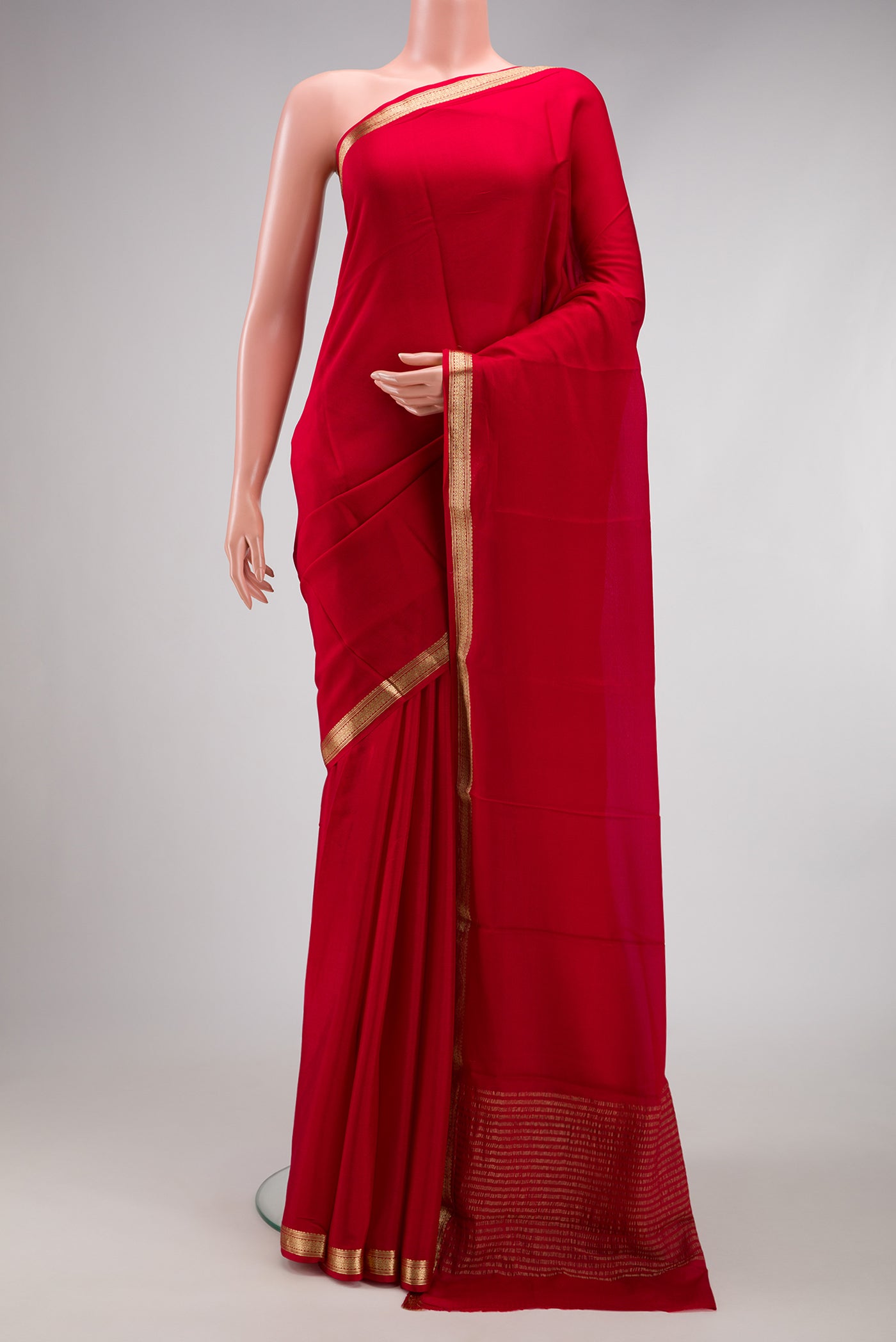 Red Dual Tone Mysore Crepe Saree with Plain Body and Zari Border.  displayed on a mannequin
