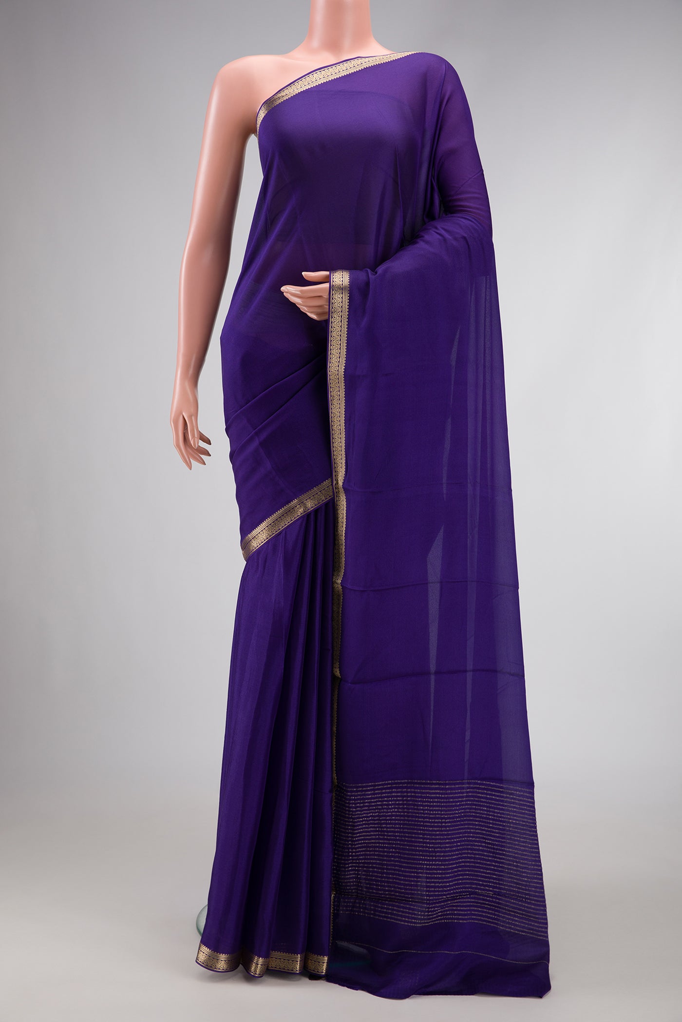 Navy Blue Dual Tone Mysore Georgette Saree with Plain Body and Zari Border.  displayed on a mannequin