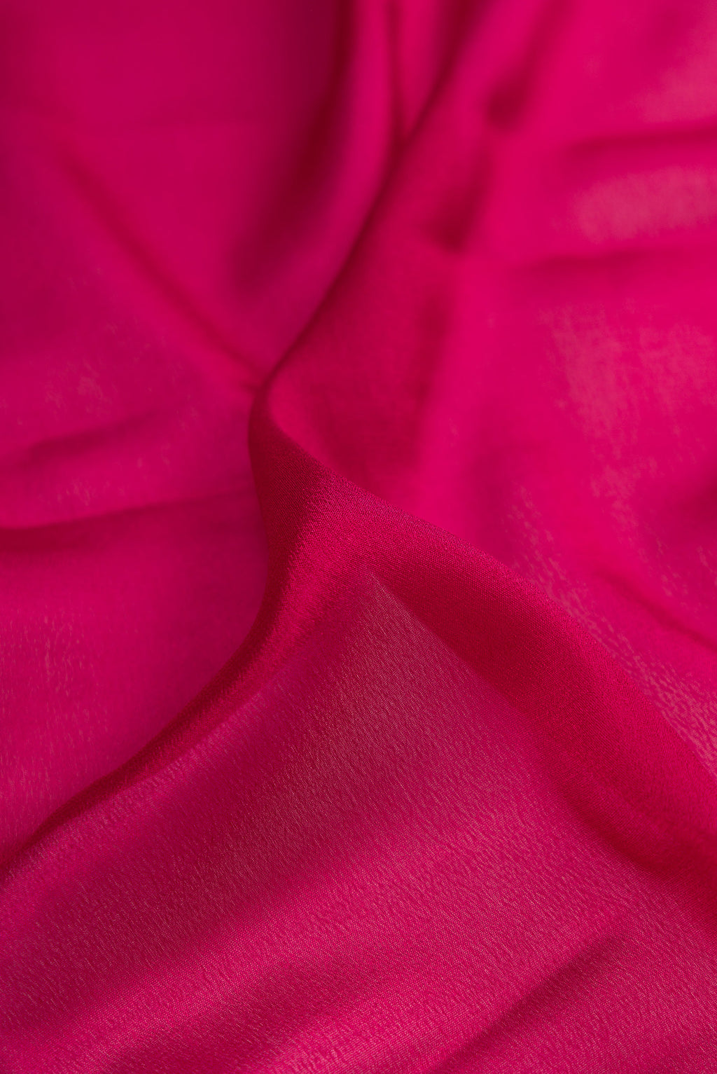 Close up of Maroon Dual Tone Mysore Crepe Saree with Plain Body and Zari Border.  displaying folds