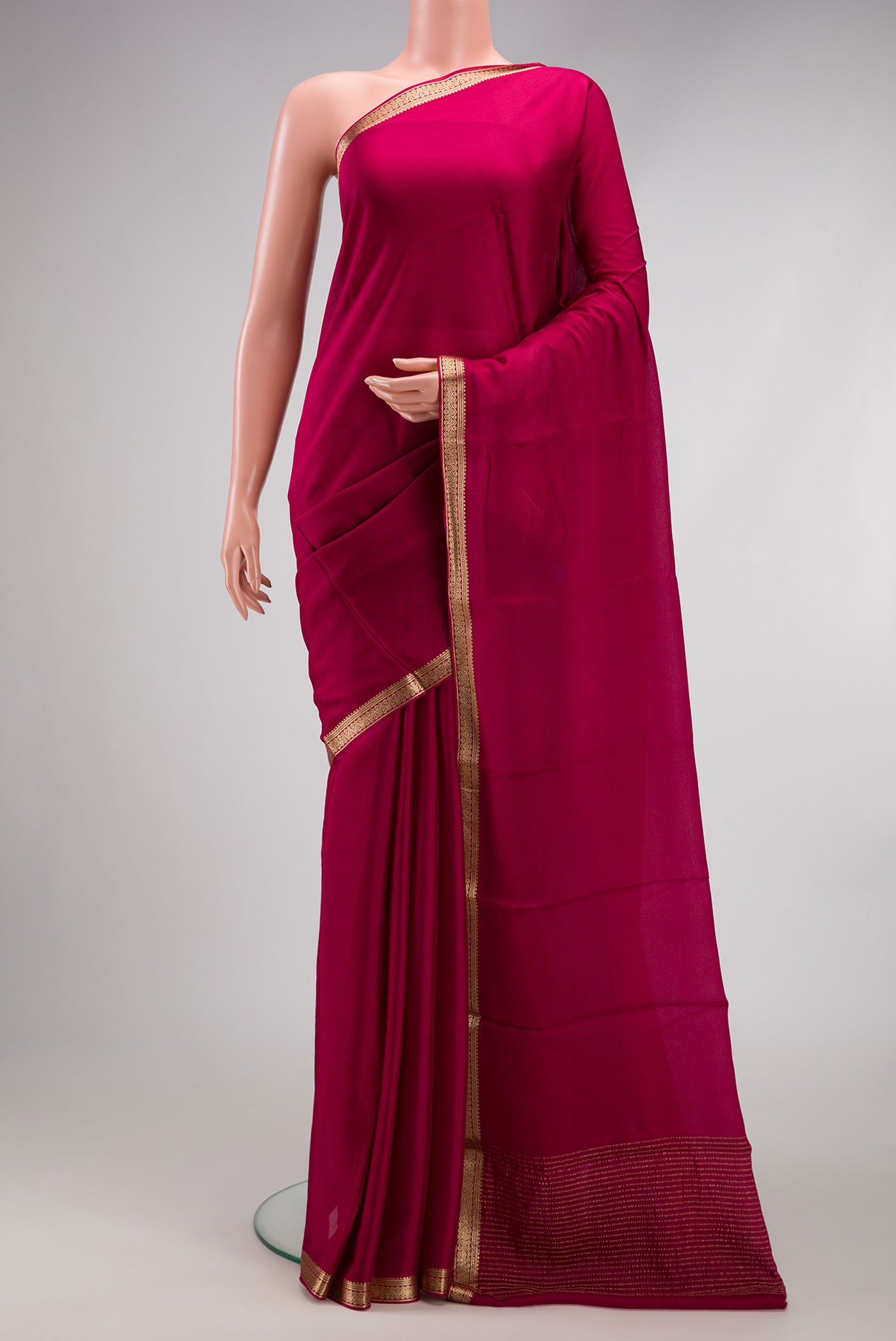 Maroon Dual Tone Mysore Crepe Saree with Plain Body and Zari Border.  displayed on a mannequin