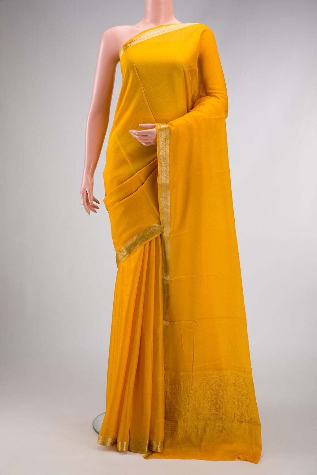 Yellow Dual Tone Mysore Georgette Saree with Plain Body and Zari Border.  displayed on a mannequin
